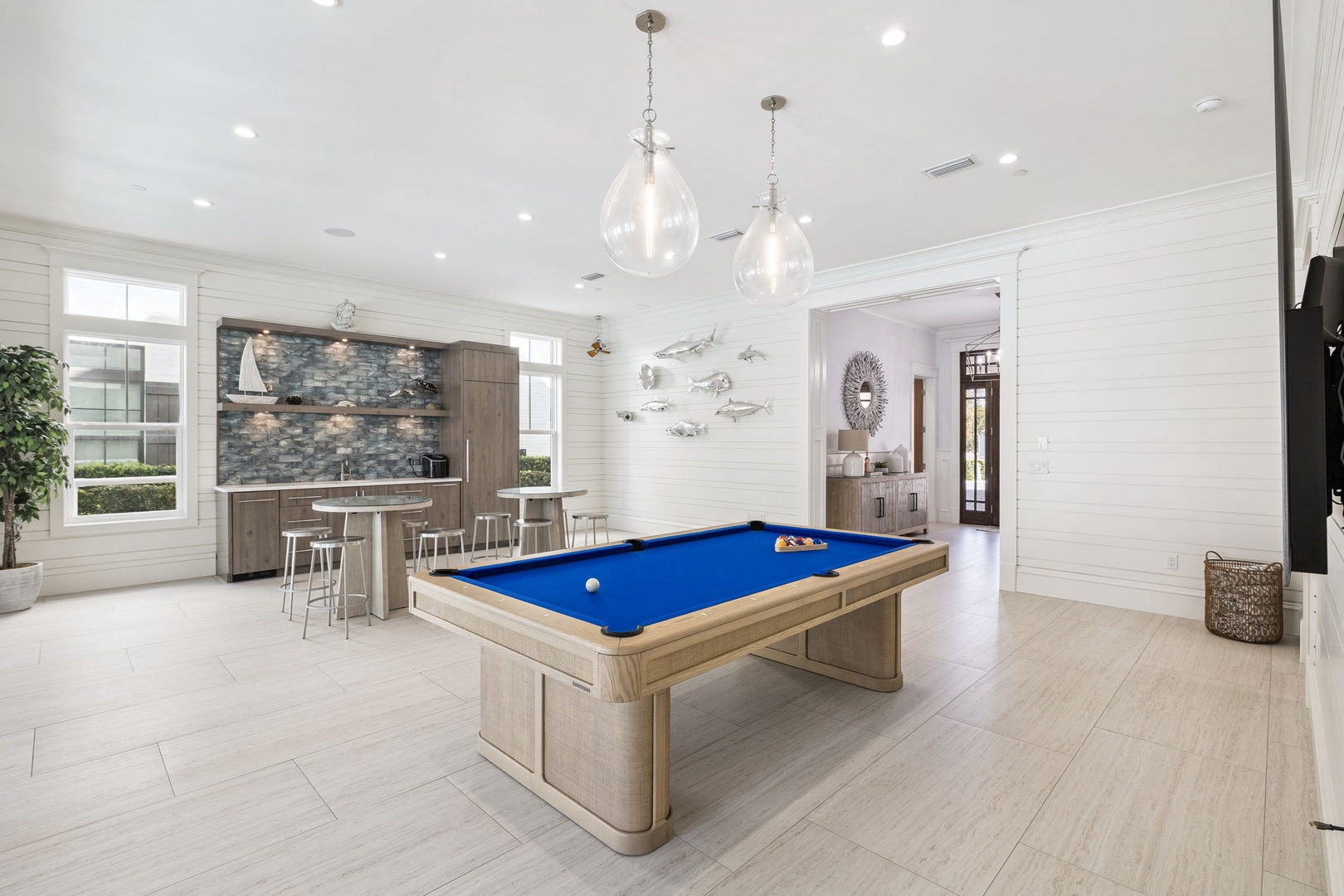 Challenge friends to pool games in this stylish entertainment space, complete with coastal decor and a full kitchen bar for snacks.