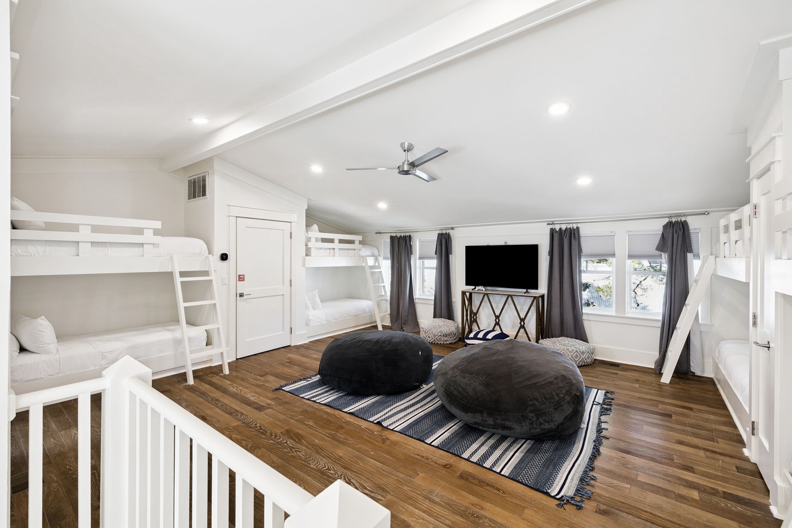 Your spacious bunk room features comfortable beds for the whole group, plus cozy floor cushions for relaxing together while watching movies.