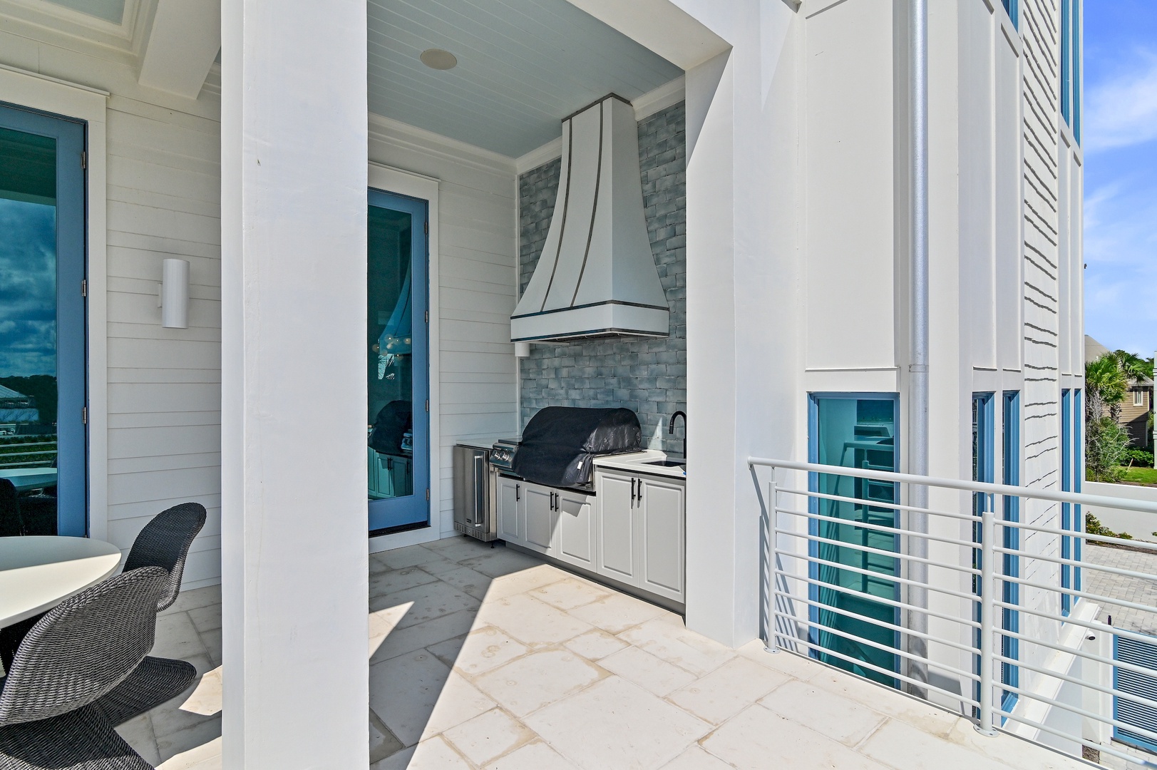 Step outside to your private covered balcony, where a built-in grill and sleek outdoor kitchen await. Fire up the barbecue and enjoy meals in the fresh coastal air.