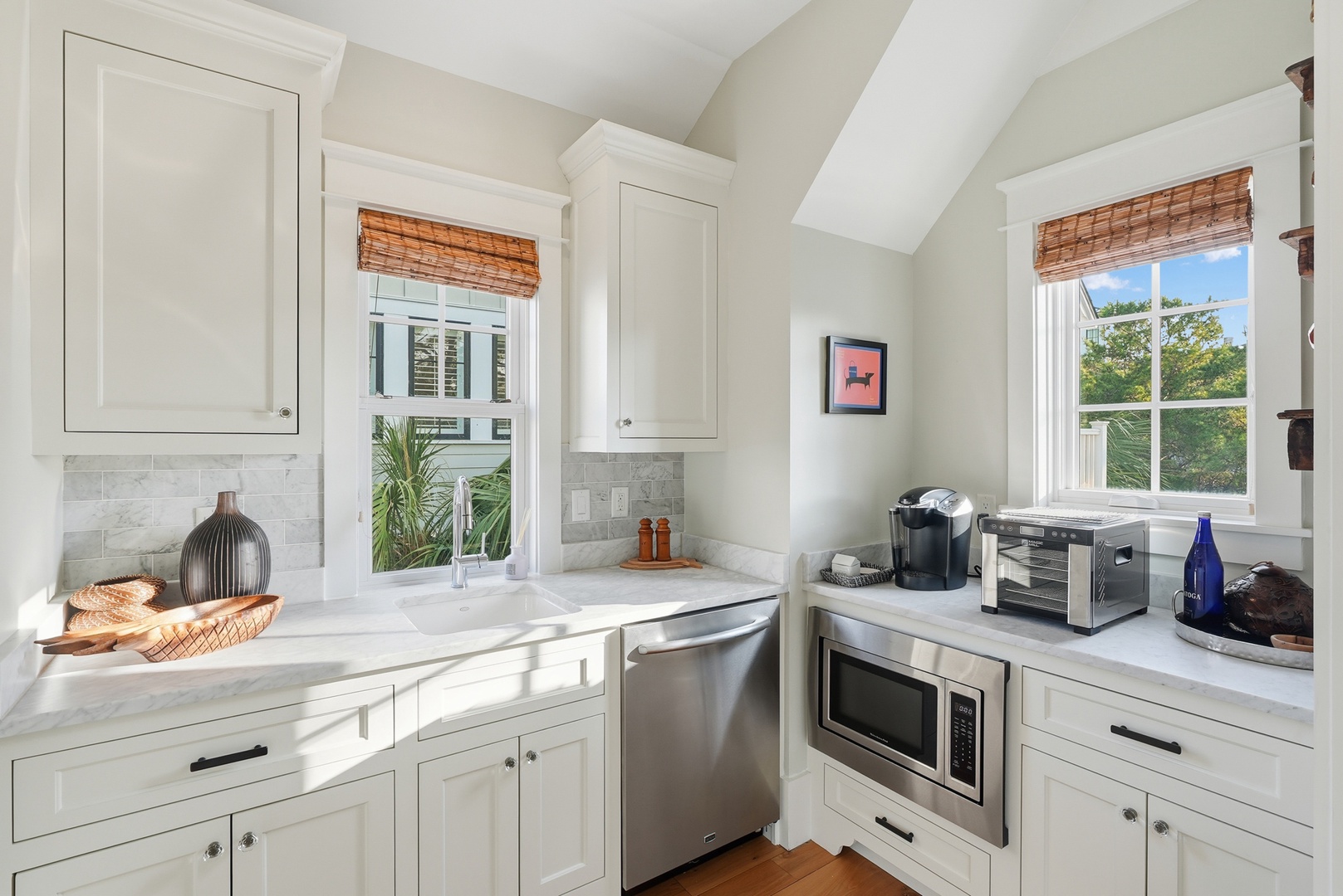 Your bright, efficient kitchen awaits, complete with stainless appliances, marble counters, and natural light pouring through the windows. Perfect for brewing morning coffee or unwinding after a day exploring.