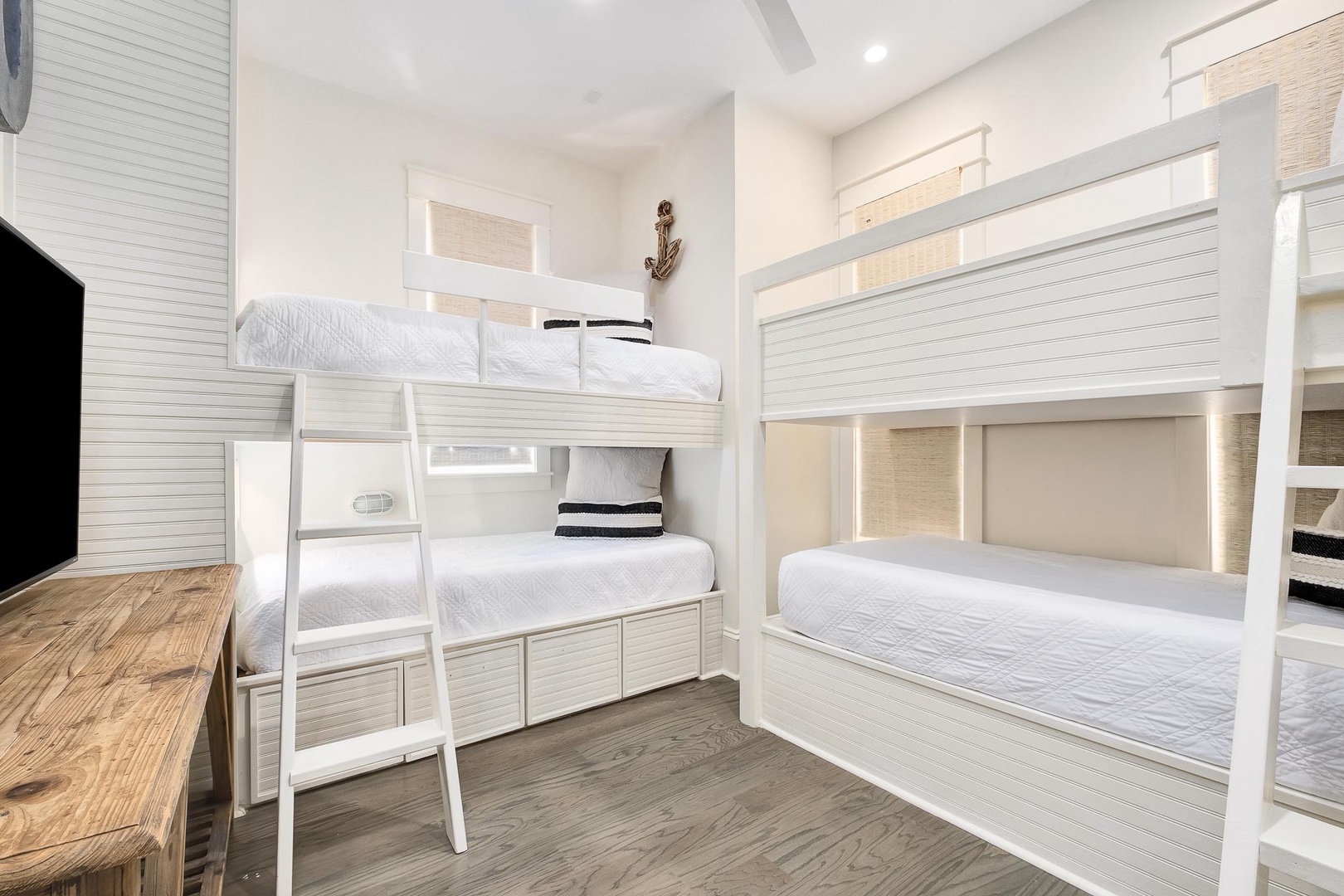 Sleep soundly in your coastal-themed bunk room with crisp white linens and nautical touches that make bedtime an adventure.