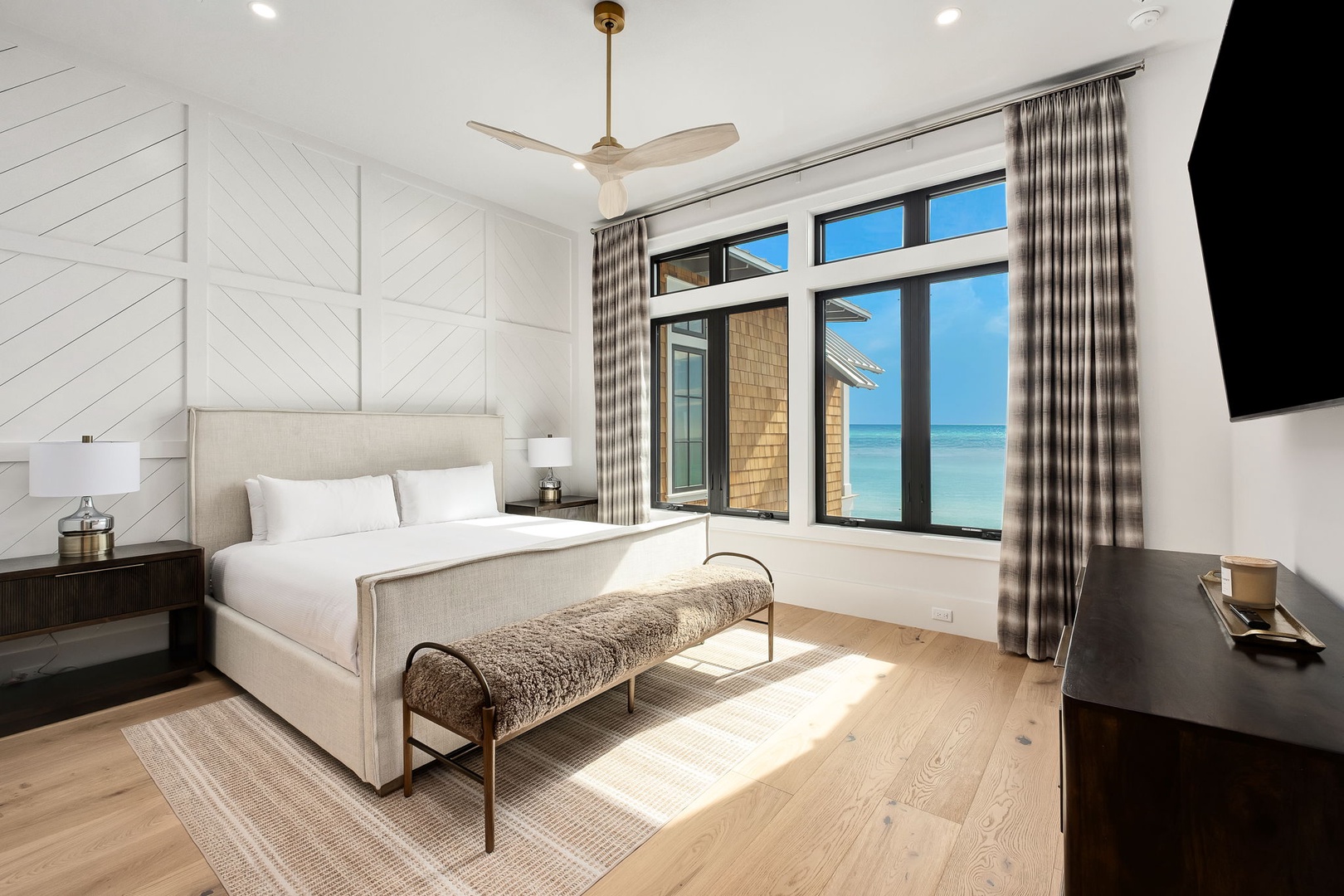 Wake up to stunning ocean views through your floor-to-ceiling windows, where turquoise waters greet you each morning in this elegant coastal retreat.
