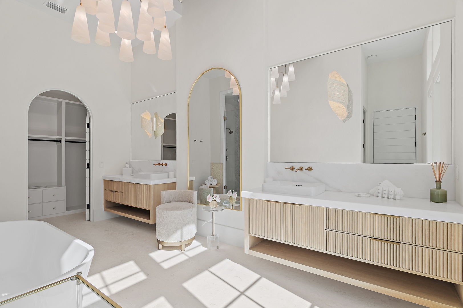 Step into your luxurious ensuite featuring dual vanities, elegant archways, and radiant natural light. This serene retreat blends sophisticated design with spa-like comfort for your ultimate relaxation.