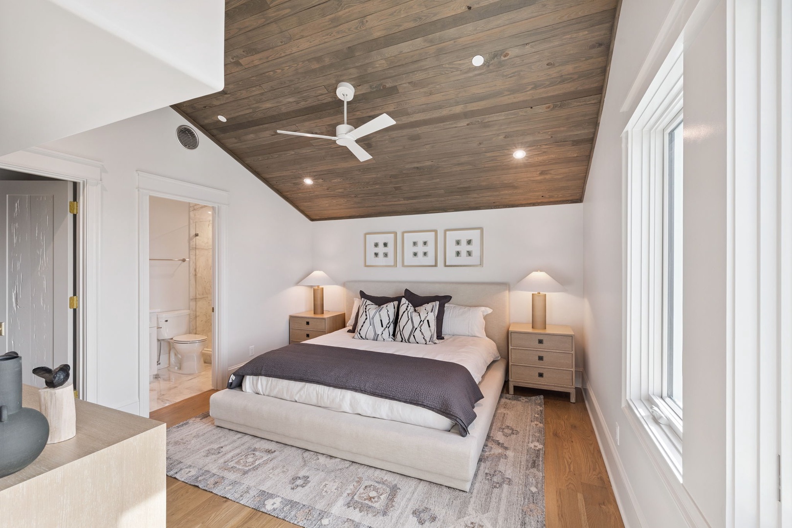 Drift off under a stunning wood-planked ceiling with soft lighting and a whisper-quiet fan. Your plush king bed and elegant furnishings create a peaceful retreat after a day of adventure.