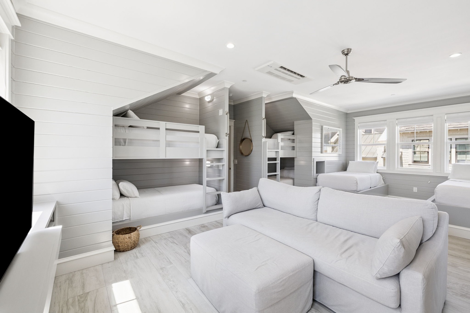 Your perfect family getaway features custom bunk beds and a cozy living space where everyone can unwind together after beach adventures.