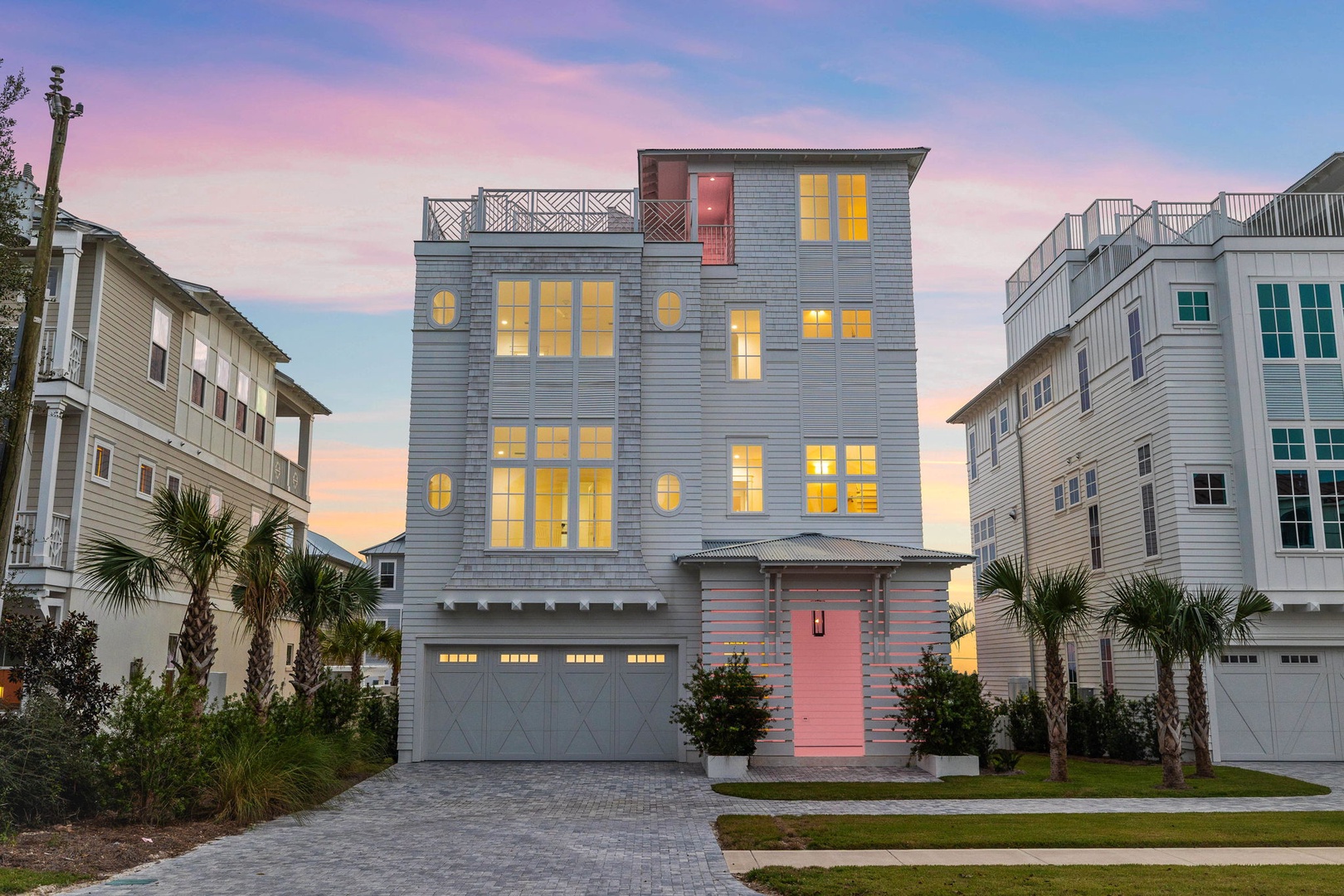 Modern coastal retreat with stunning architecture nestled among palm trees in an upscale beachside neighborhood.