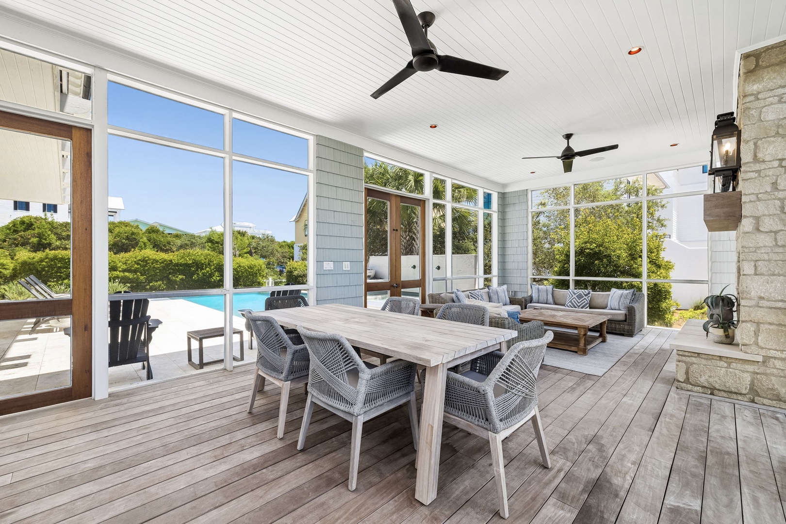 A spacious covered patio with dining and lounge areas opens to your private pool, blending indoor comfort with breezy outdoor charm—perfect for al fresco meals or relaxed evenings.