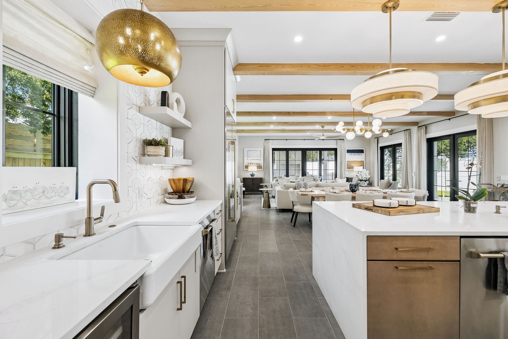 Step into your designer kitchen with gleaming marble counters, statement lighting, and an open flow into your bright living space—where every meal becomes an experience.