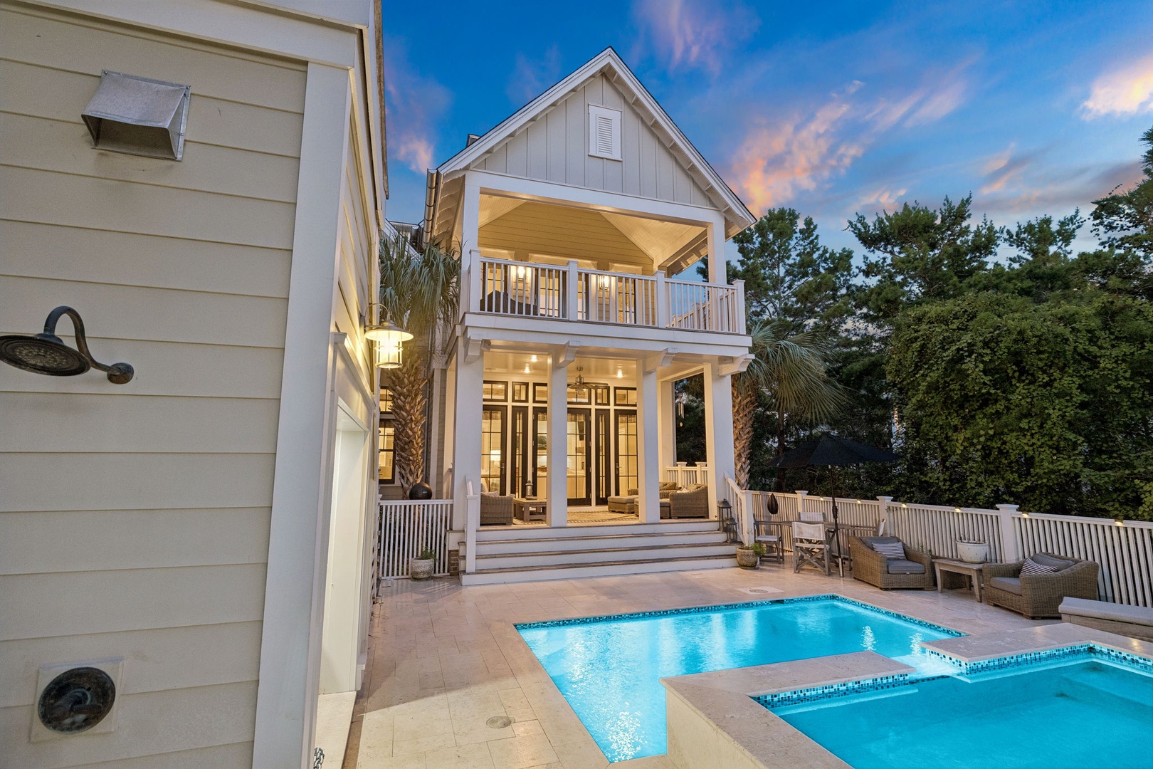 Stunning coastal cottage with a private pool and spa awaits your arrival. The inviting outdoor space offers a perfect blend of relaxation and luxury, surrounded by lush greenery and warm southern charm.