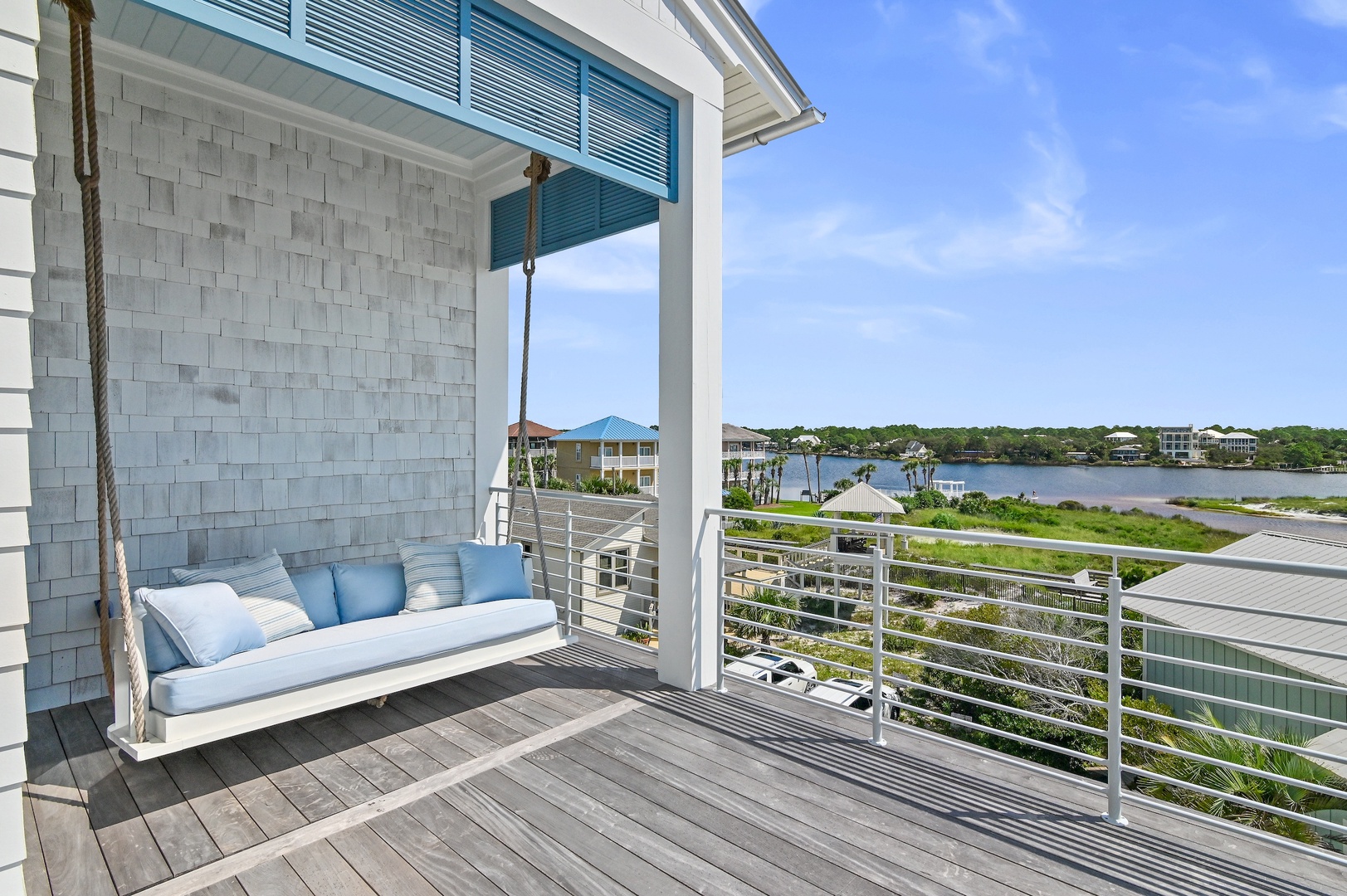 Swing gently on your private porch swing as you take in peaceful water views. A shaded coastal retreat perfect for morning coffee or evening relaxation.