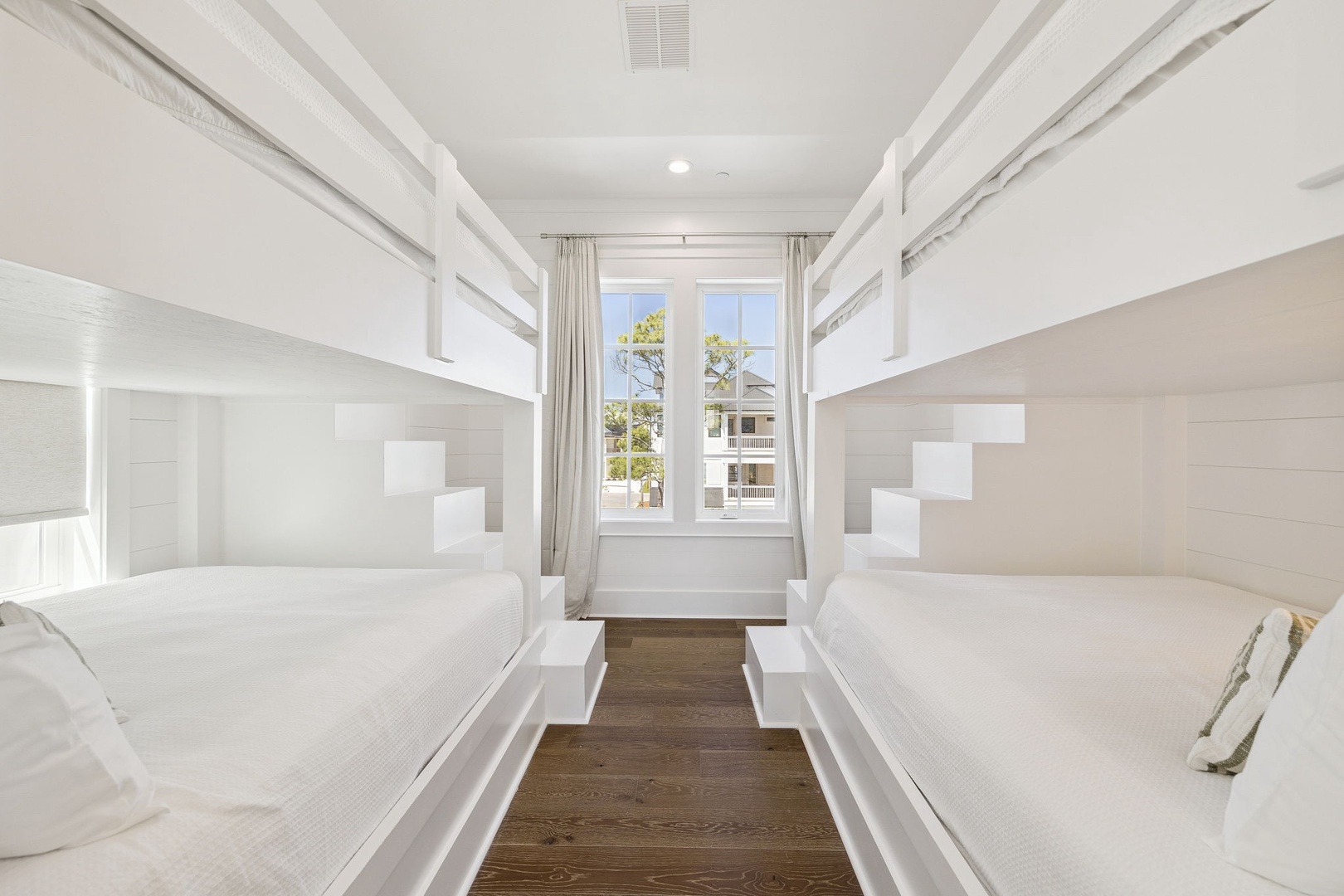 Sleep soundly in your private bunk room with built-in steps and crisp white linens - perfect for families or groups sharing adventures.