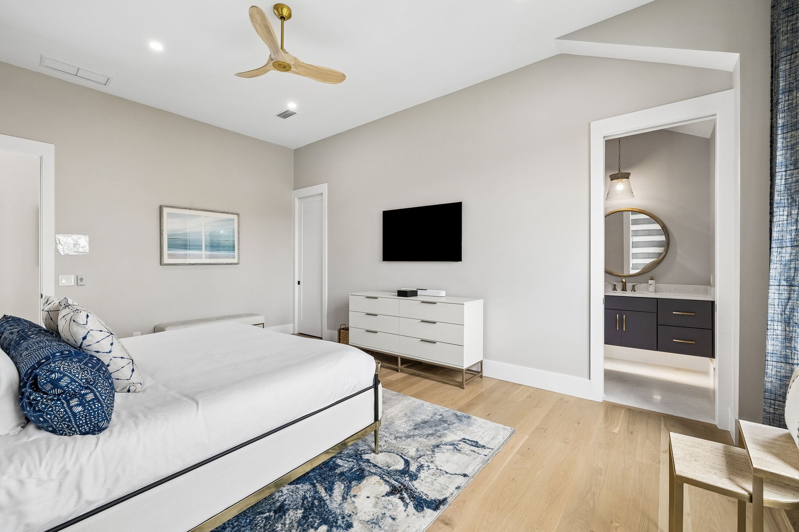Unwind in your spacious bedroom, where modern comfort meets coastal elegance. Crisp linens, stylish decor, and natural light create a serene retreat designed just for you.