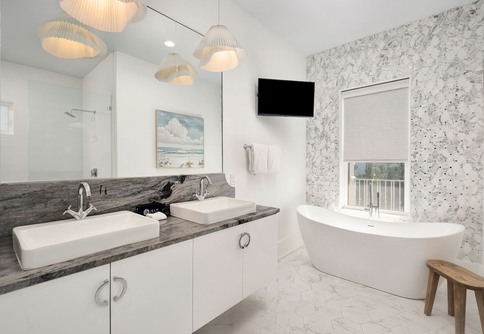Luxuriate in your spa-like bathroom with elegant soaking tub, dual vanities, and ambient lighting creating the perfect retreat.