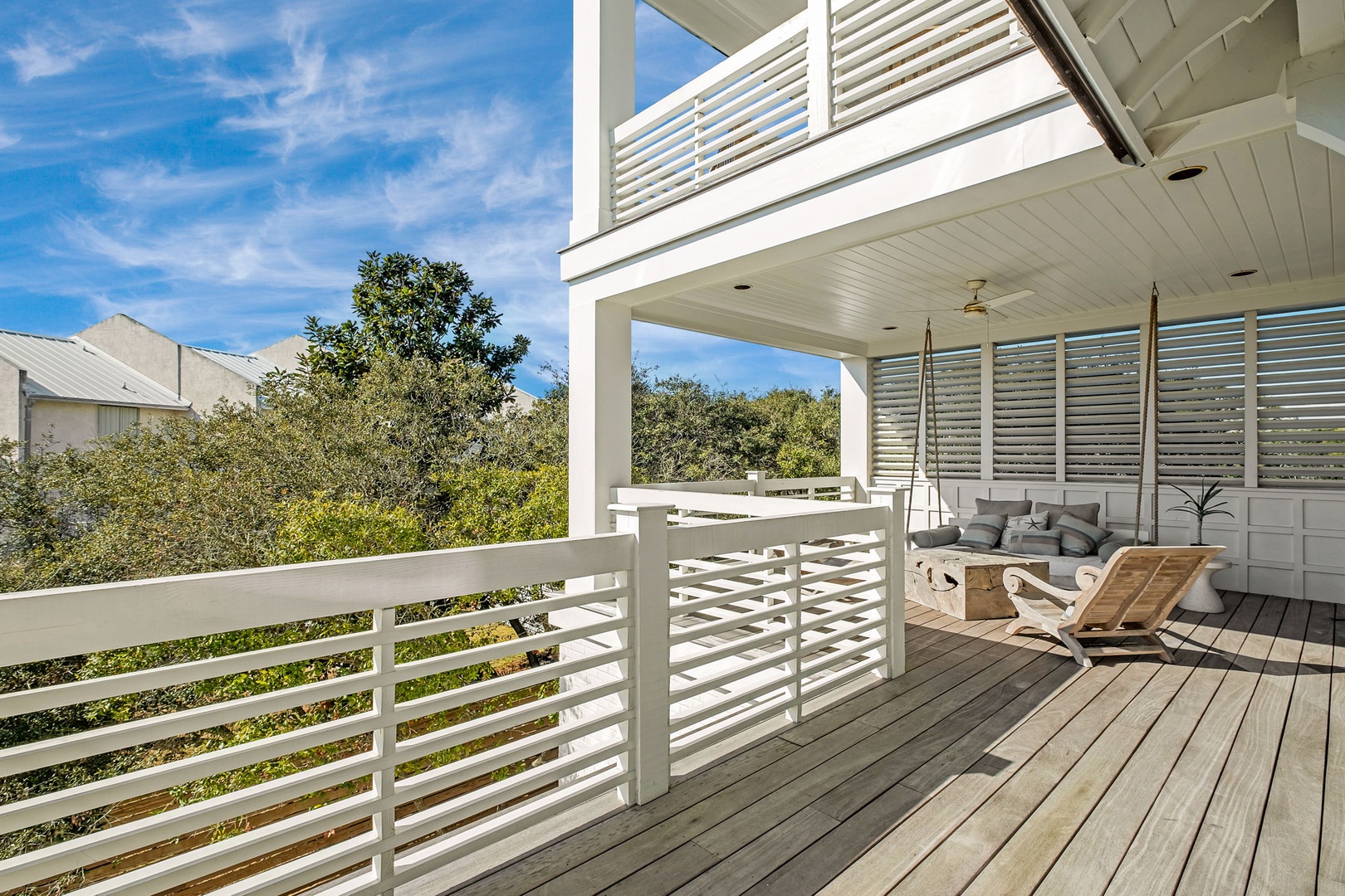 Your private covered deck offers the perfect spot to unwind with comfortable seating and peaceful views.