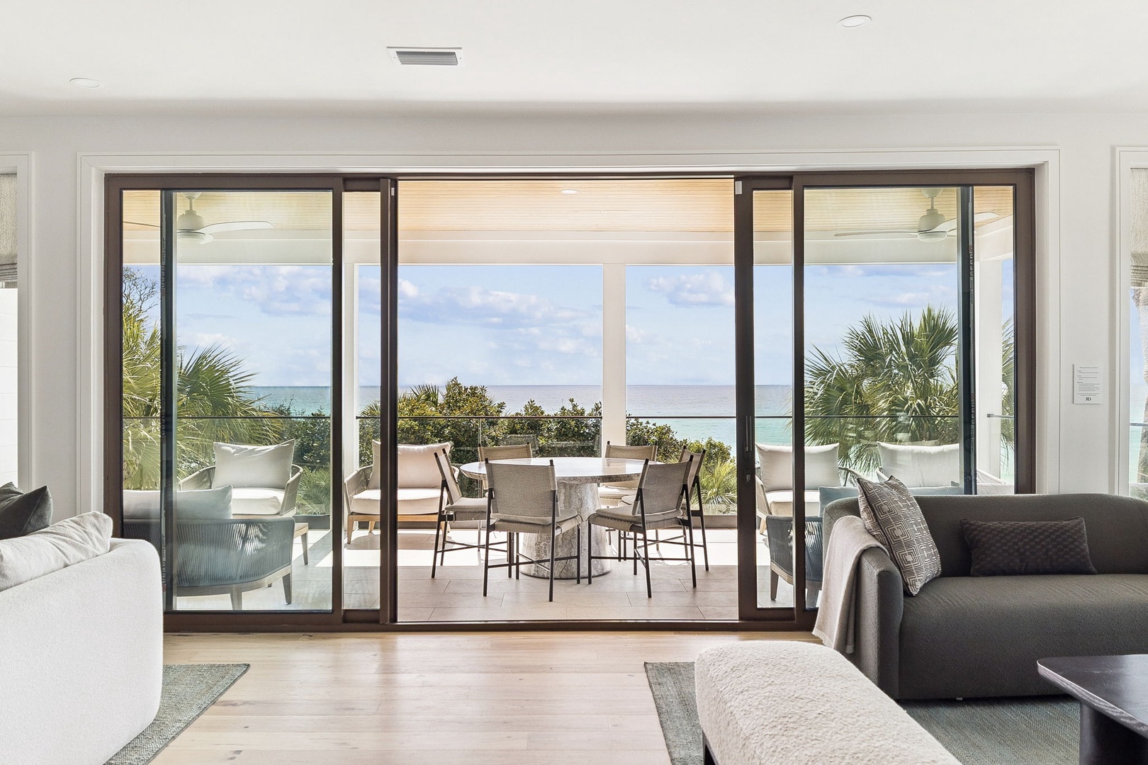 Relax in your spacious living area with seamless indoor-outdoor flow to a private terrace overlooking tropical scenery and ocean views.