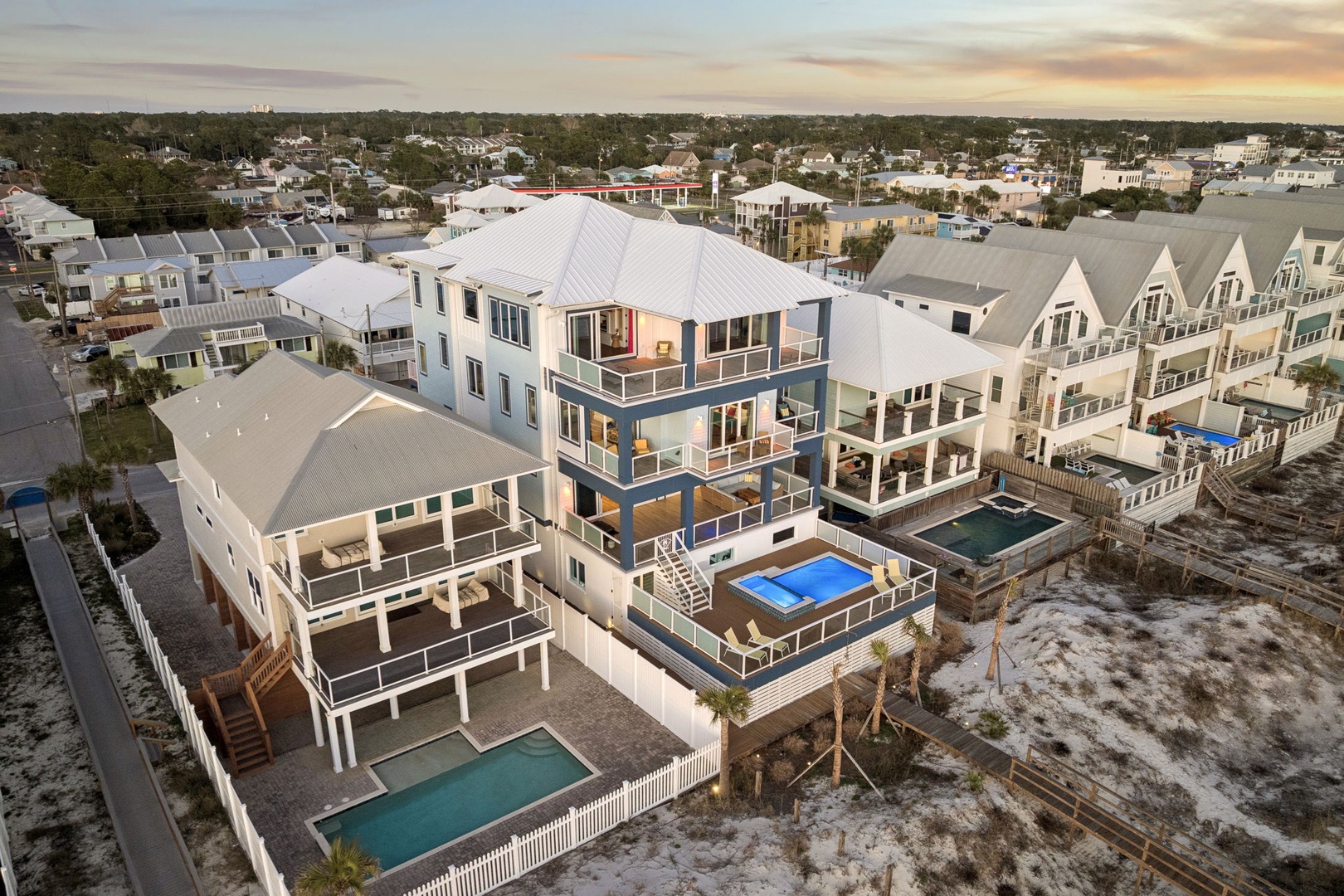 Modern beachside vacation homes with private pools showcase the coastal community's contemporary architecture and nearby amenities.