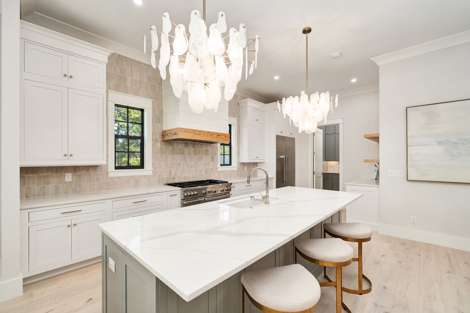 Your gourmet kitchen awaits with stunning chandeliers, marble countertops, and professional-grade appliances for unforgettable culinary experiences.