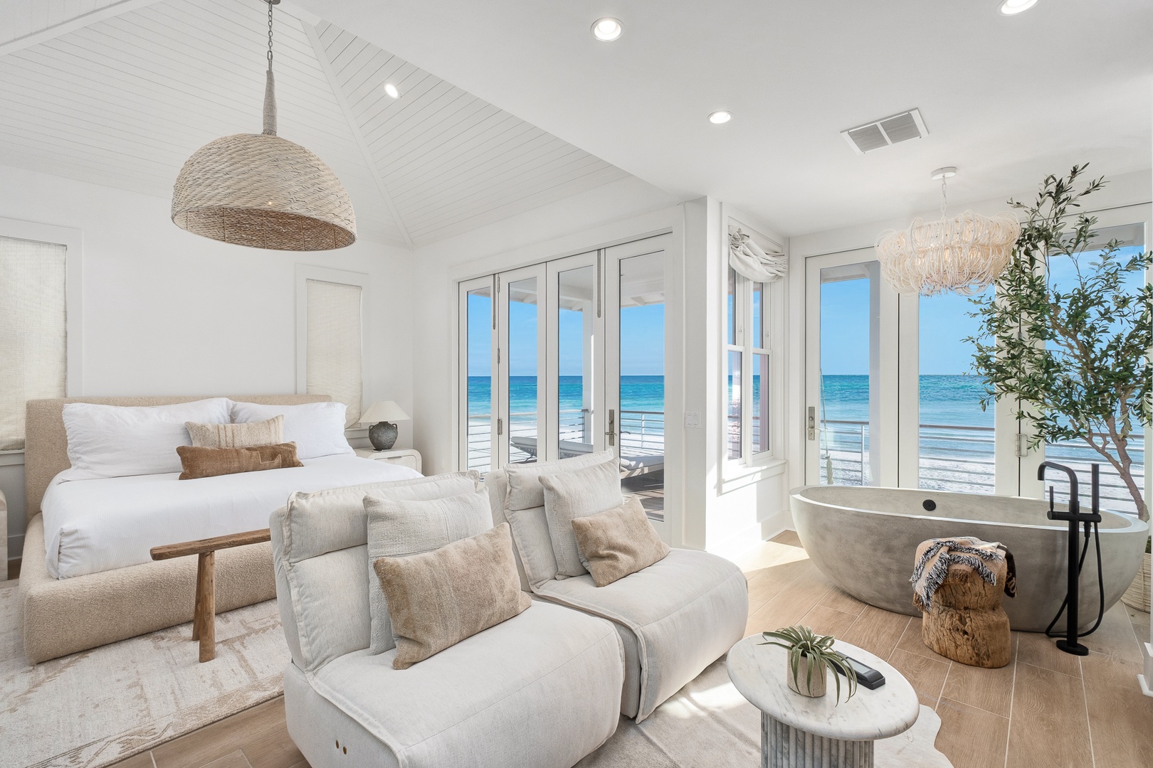 Drift off to sleep with ocean waves as your soundtrack in this dreamy beachfront suite, featuring a luxurious soaking tub.