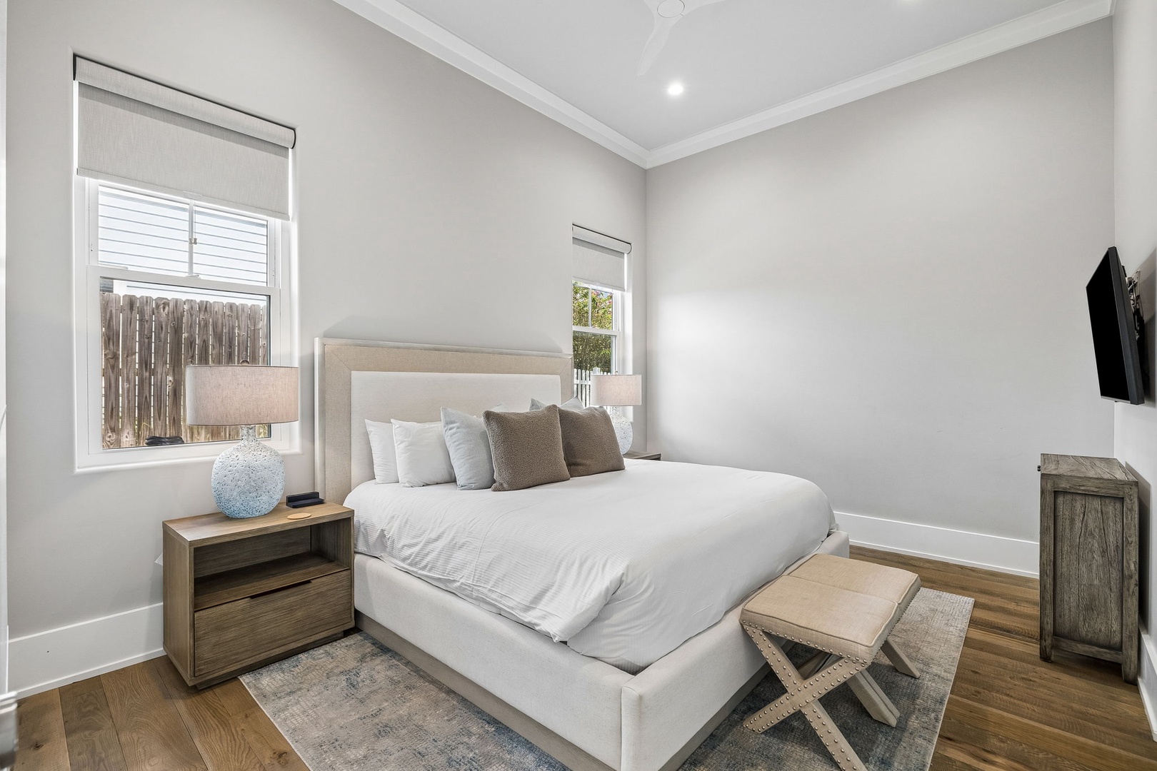 Unwind in this serene bedroom with its plush bedding, soft lighting, and peaceful neutral tones designed to help you recharge after a day of exploring.