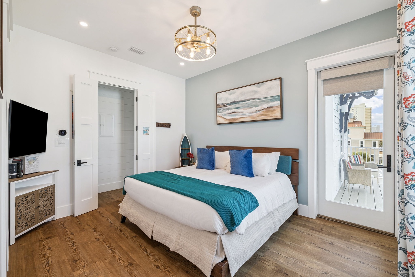 Sink into this dreamy coastal bedroom where ocean-inspired blues meet warm wood tones, creating your perfect seaside sanctuary.