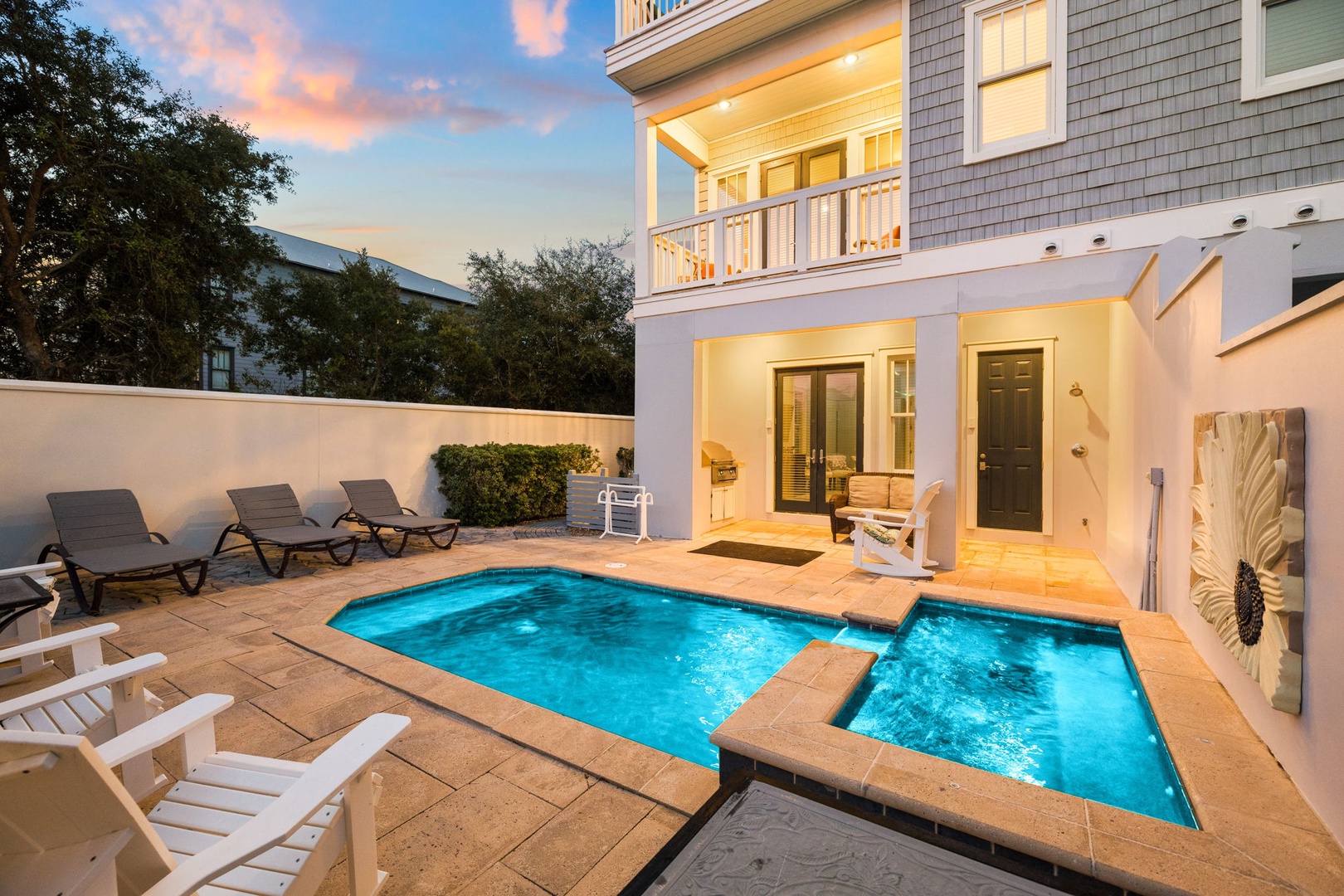 A beautiful private pool awaits in your fenced backyard, complete with lounge chairs and direct access to the living spaces—perfect for relaxing after a day of adventure.