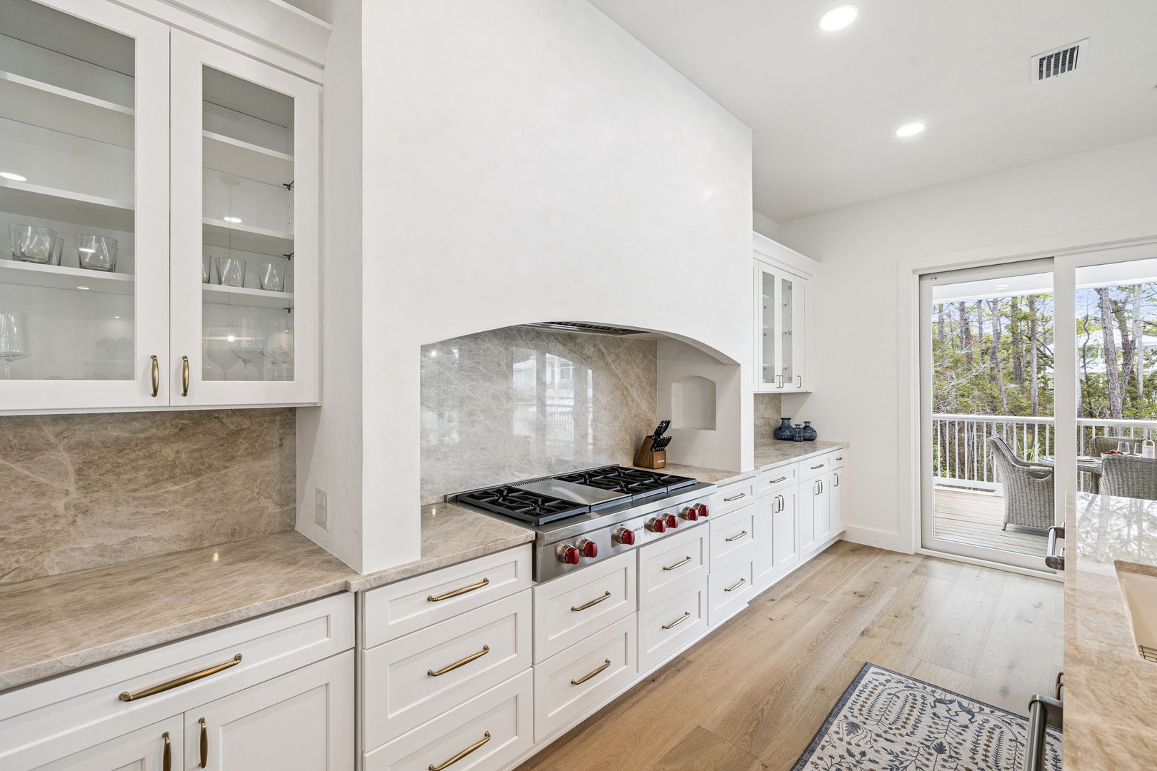 Step into your dream kitchen with gleaming white cabinets, premium stone countertops, and professional-grade appliances ready for your culinary adventures.