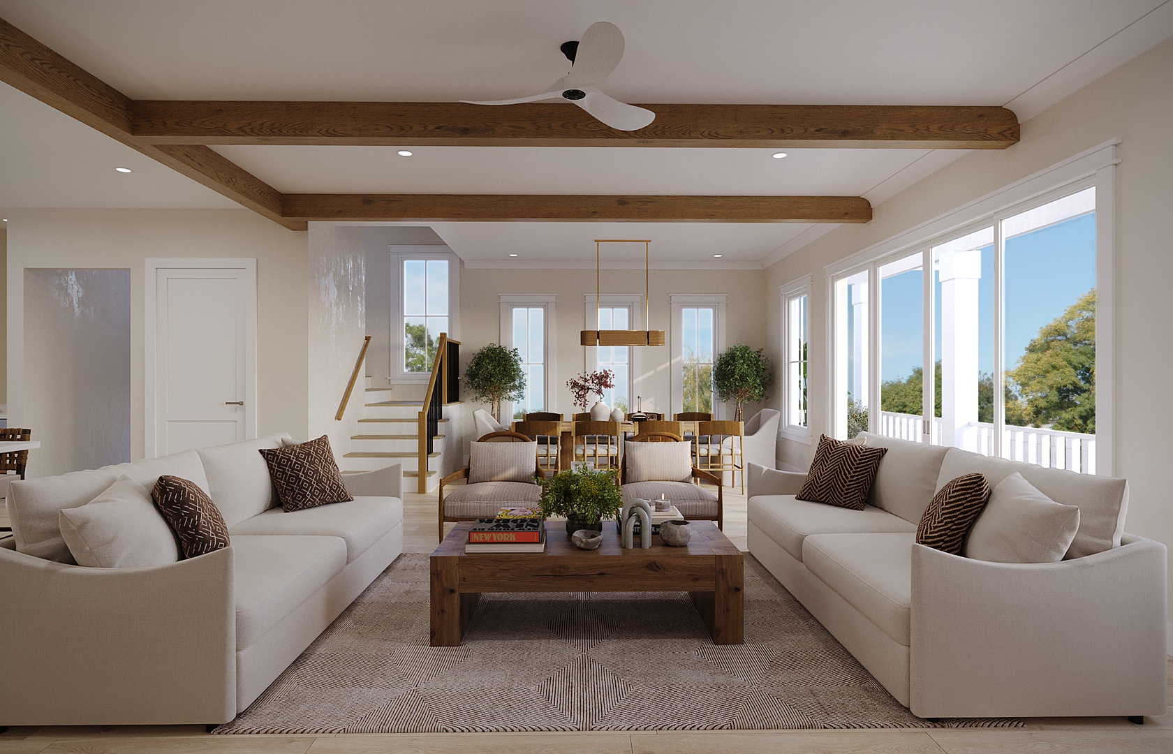 Relax in your spacious living area with plush sofas, exposed beams, and bright windows overlooking lush greenery.