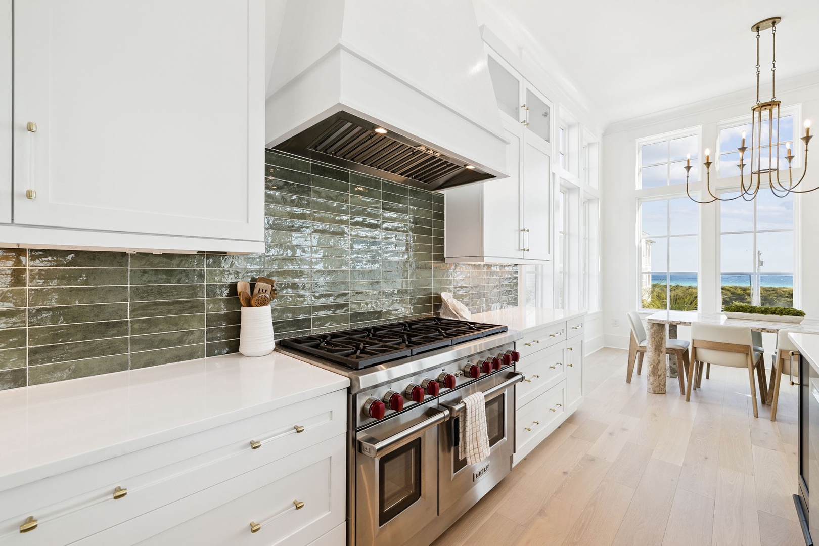 Your gourmet kitchen awaits with professional-grade appliances and stunning ocean views as your backdrop while you cook.