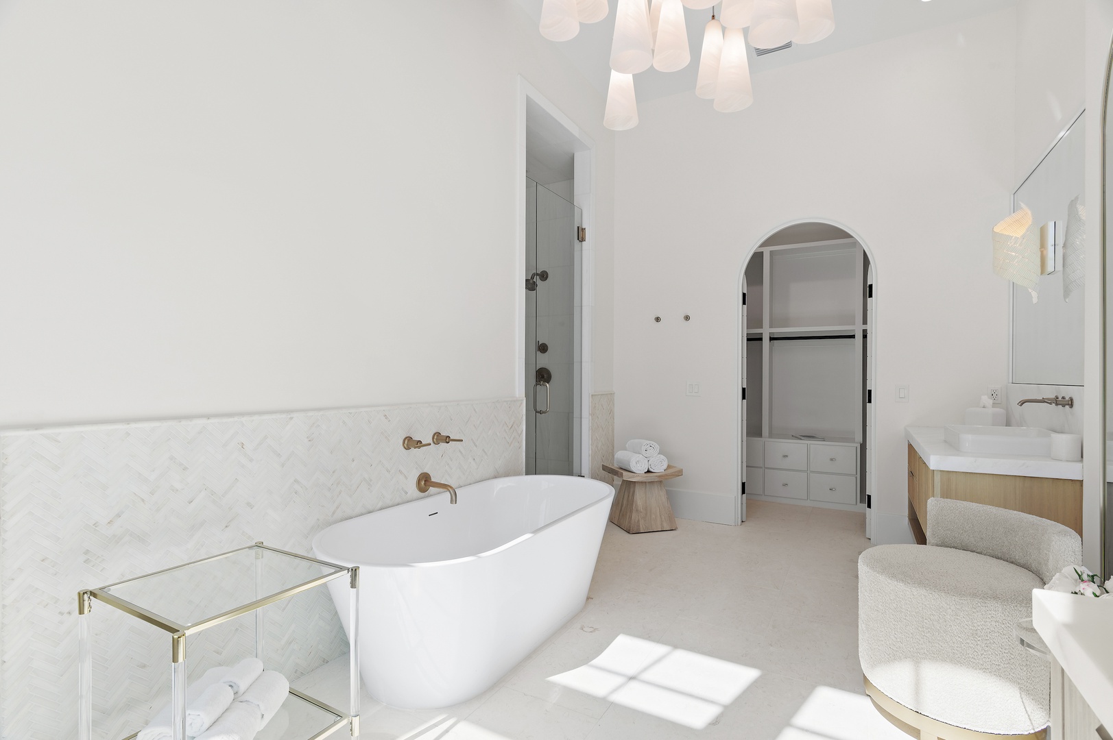 Sink into the elegant freestanding tub, surrounded by marble accents and natural light. Your private spa-like retreat awaits with luxurious finishes and thoughtful design at every turn.