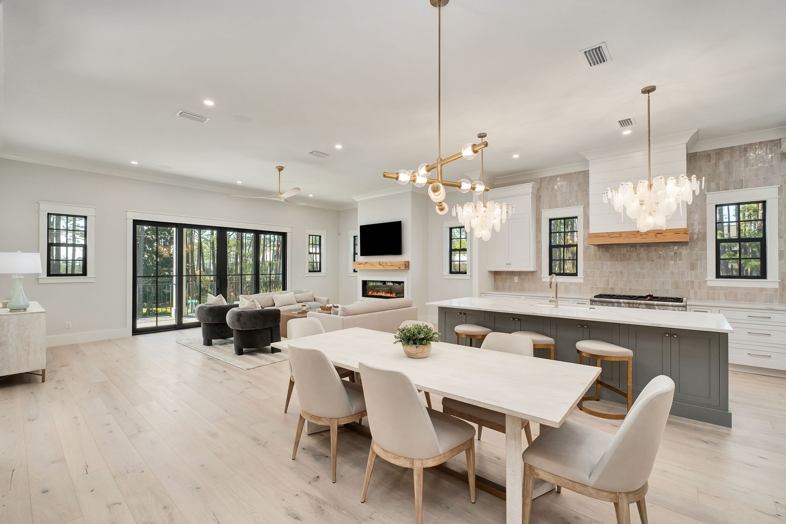 Your open-concept living unfolds with elegant dining, gourmet kitchen, and cozy fireplace seating—perfect for memorable gatherings.