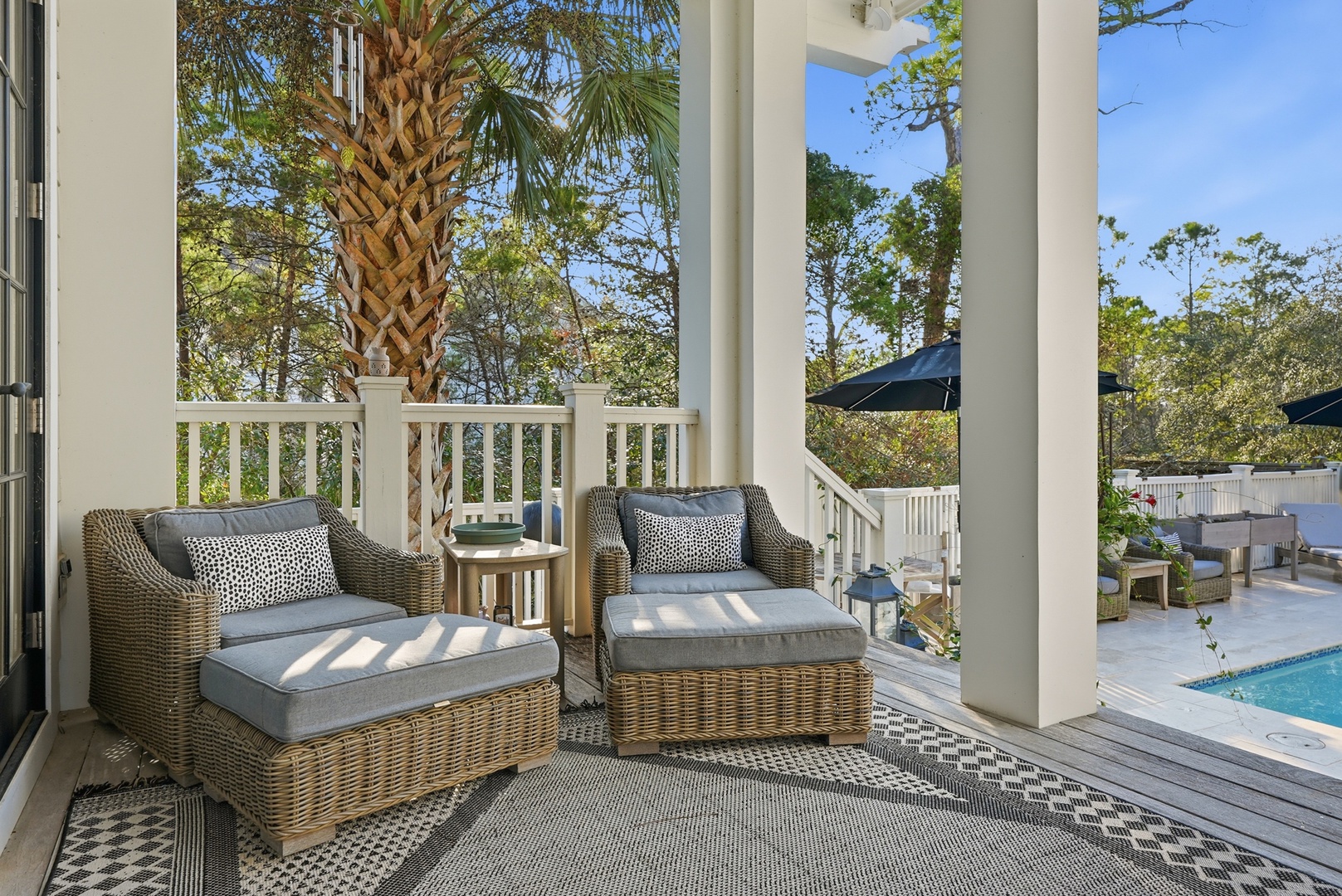 Unwind on your private porch with poolside views and lush tropical surroundings—your perfect spot to relax and soak in the sunshine.