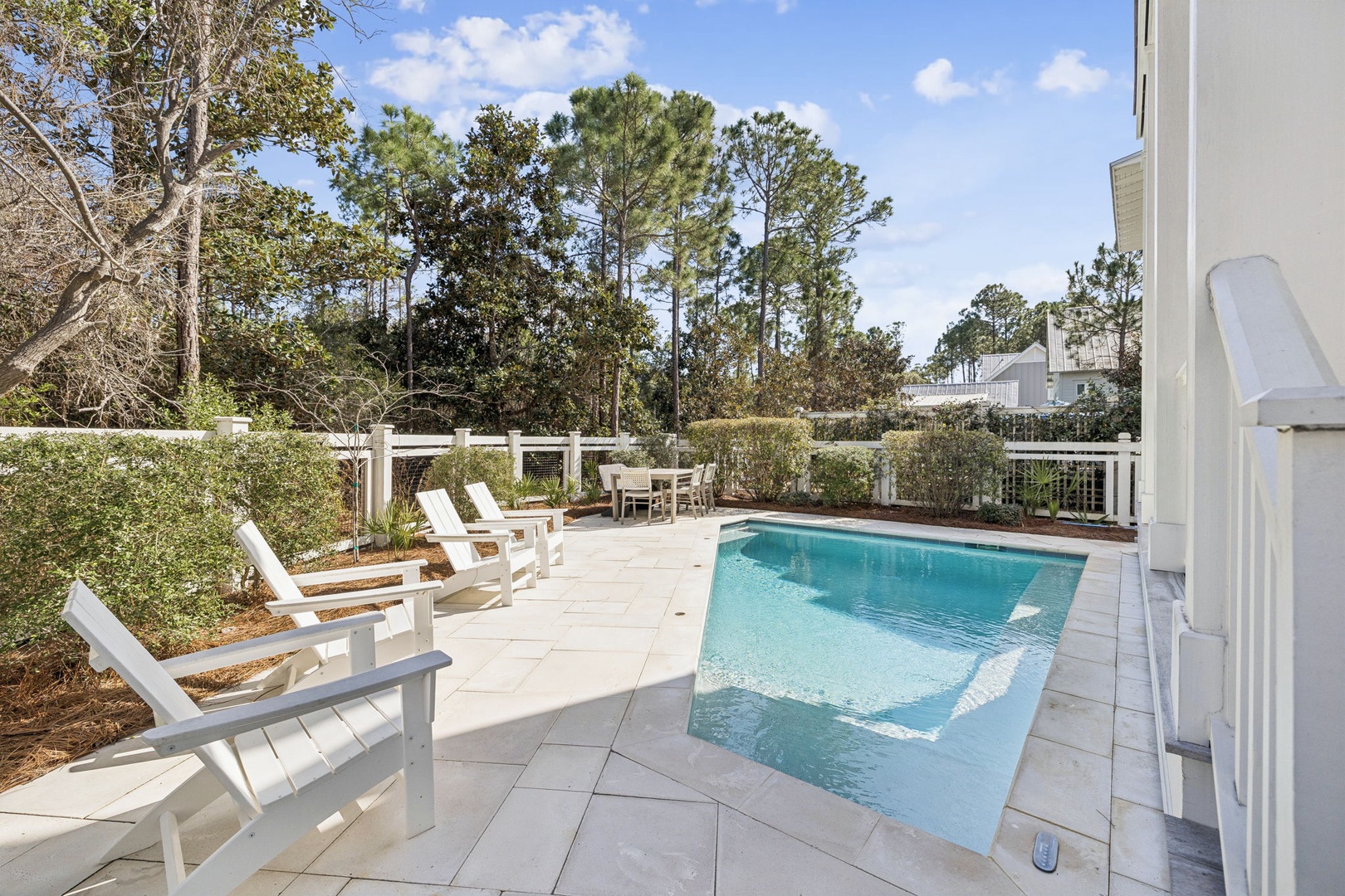 Private pool oasis with comfortable lounge chairs where you can soak up sun and unwind in your own backyard paradise.