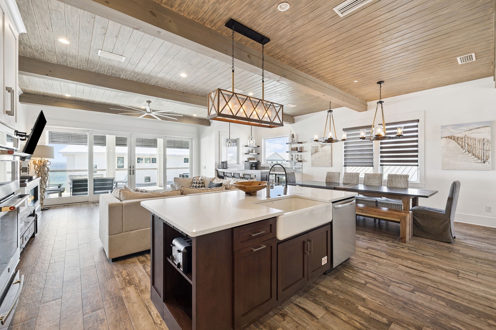 Your gourmet kitchen opens to living areas, perfect for entertaining with stunning ocean views beyond.