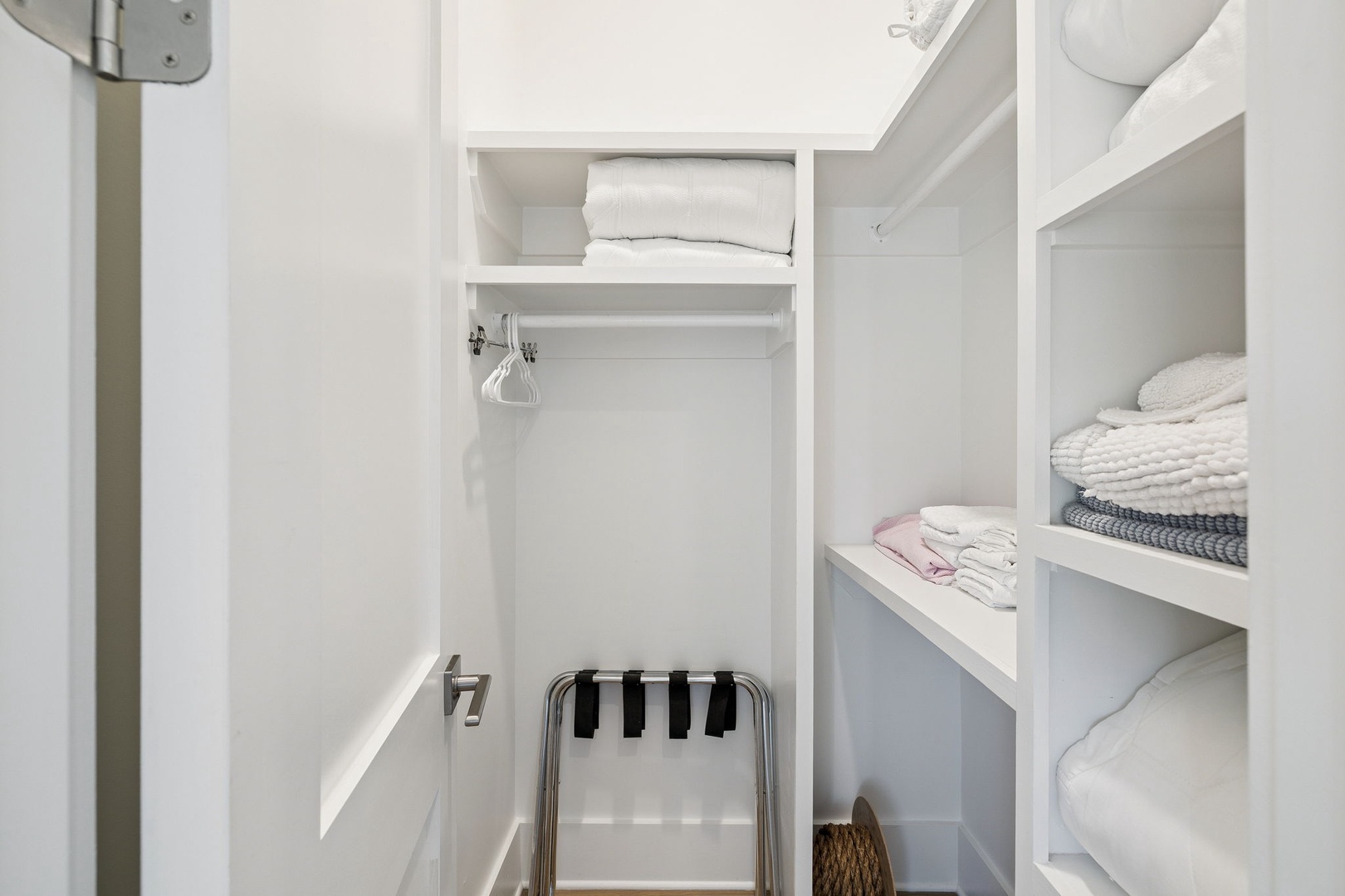 Your private walk-in closet features custom shelving and a hanging rod, keeping your belongings perfectly organized during your stay.