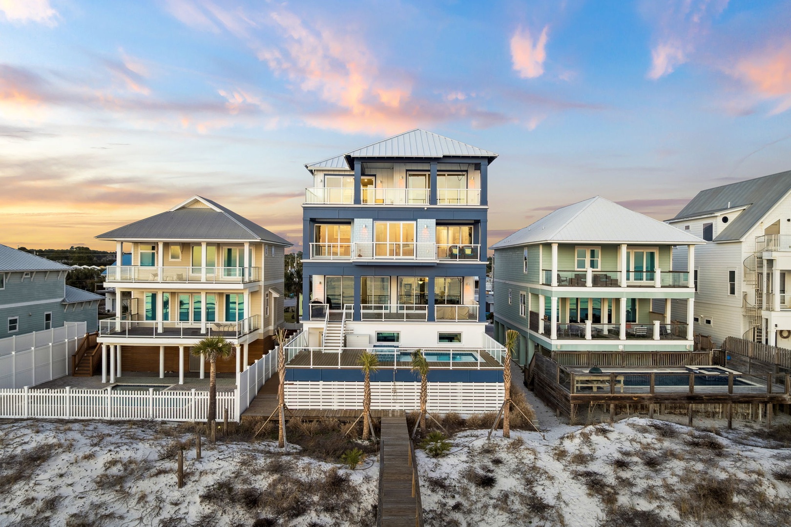 Modern beachfront home with private pool and deck, perfectly positioned among coastal neighbors for your ultimate beach getaway.