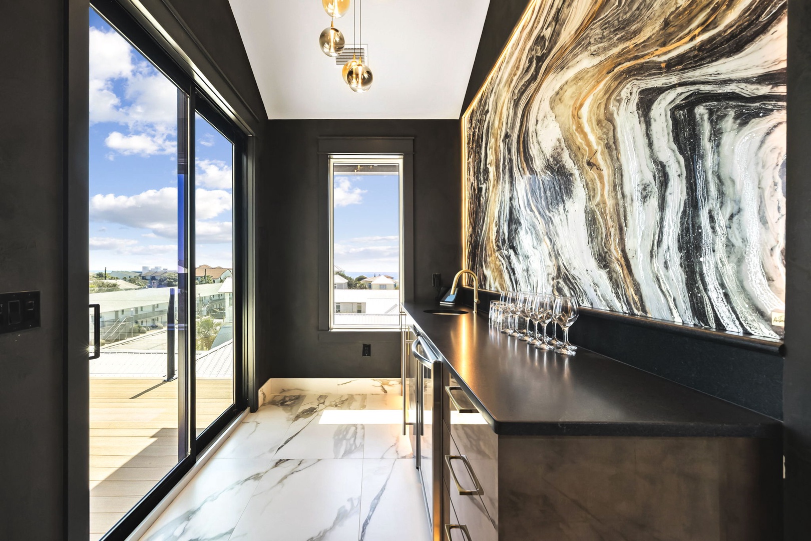 Step into your stylish bar area, where dramatic marble flooring flows beneath soaring ceilings and a stunning statement wall sets the tone for elegant gatherings.