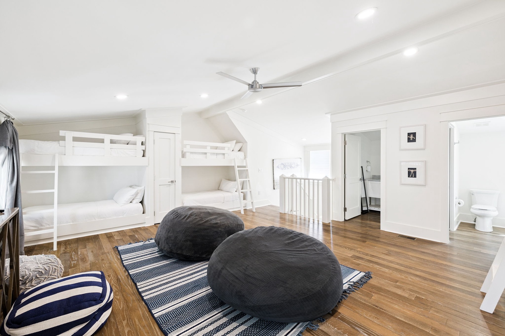 Your kids will love this spacious loft bedroom with cozy bunk beds and bean bag lounging area—perfect for family adventures!