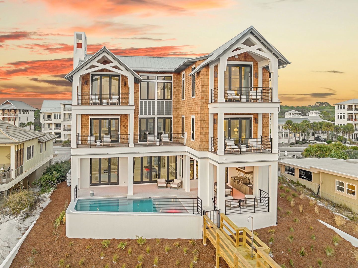 Modern beachside luxury home featuring multiple levels, private pool, and contemporary architecture set in a scenic coastal neighborhood.