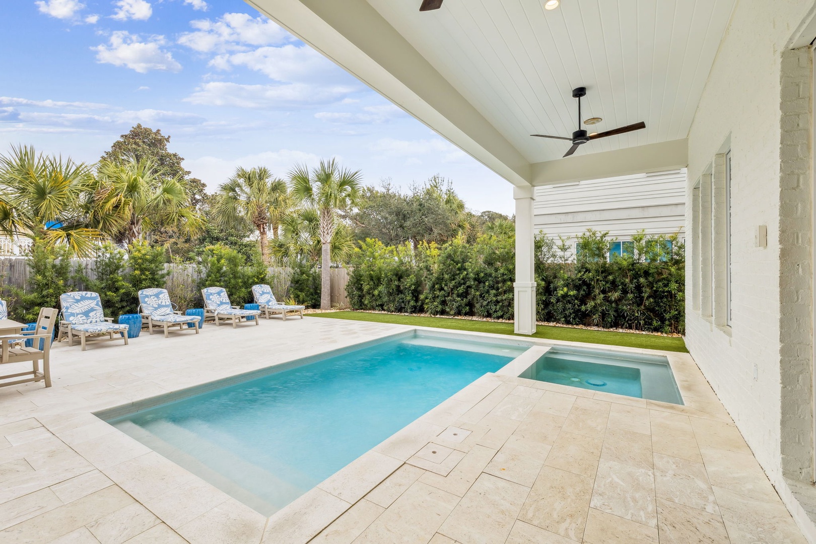 Your private pool oasis awaits with a sparkling pool and relaxing spa, perfect for sunny afternoons lounging poolside.