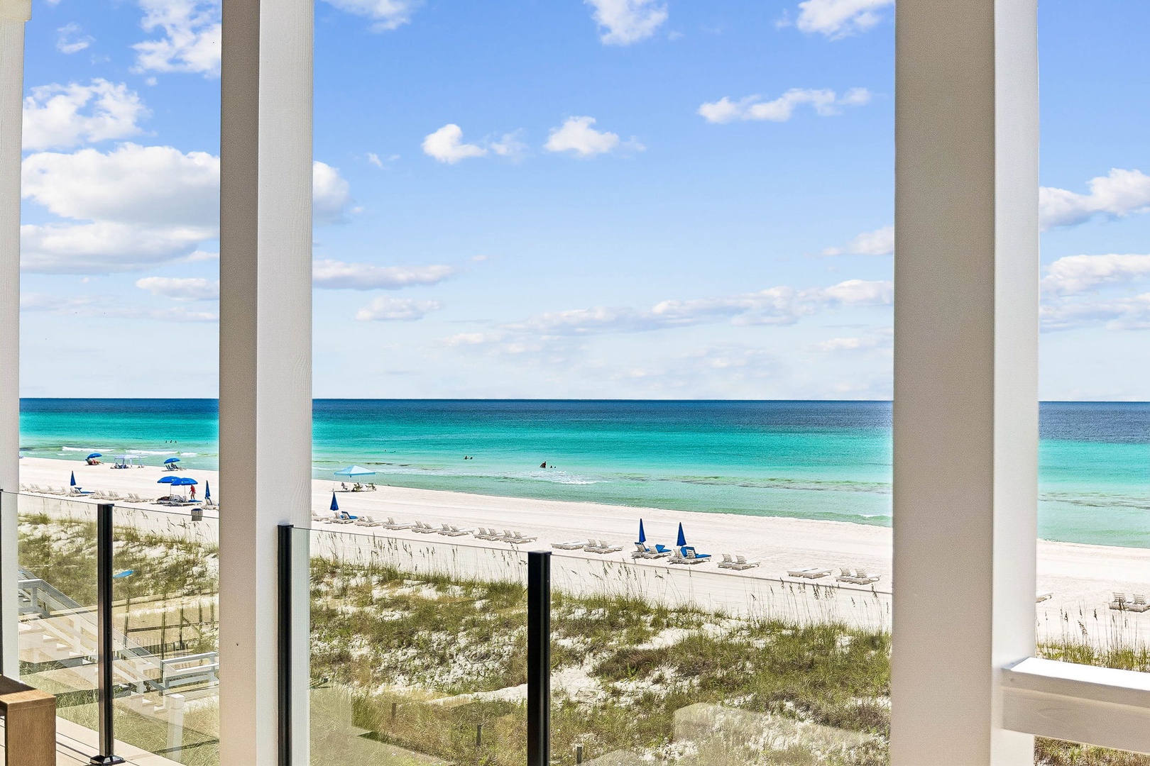 Step onto your private balcony and soak in the stunning panorama of turquoise waters stretching to the horizon, with soft white sand just steps away.
