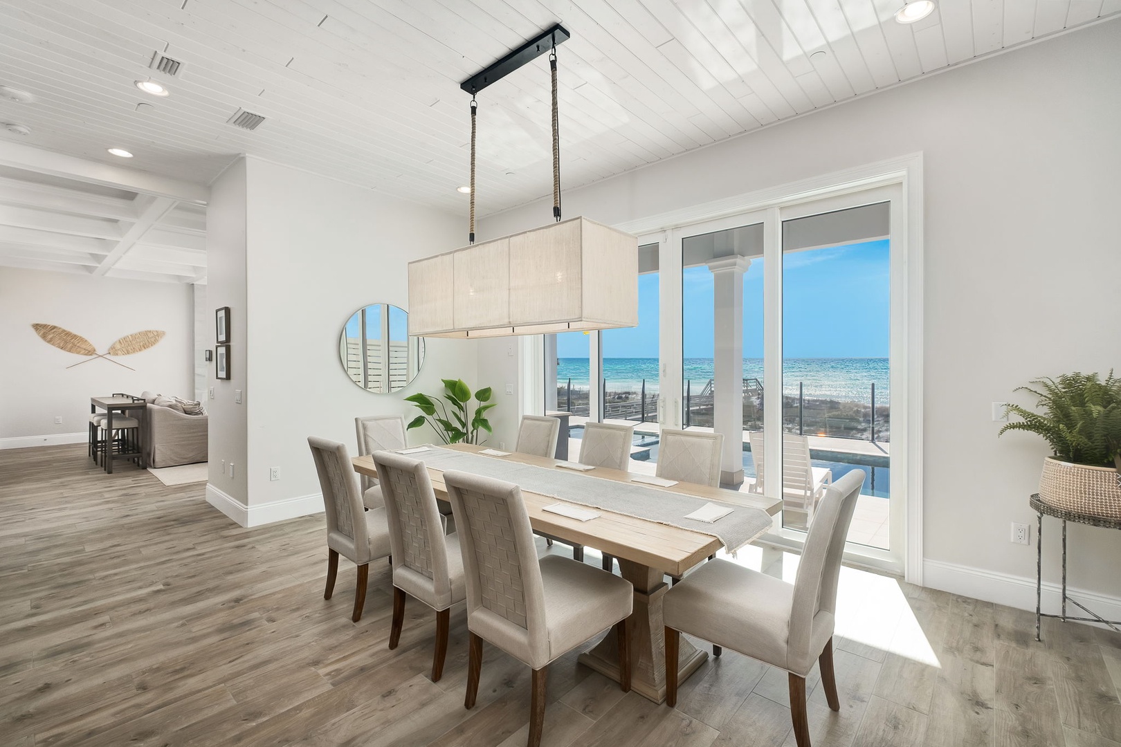 Gather around your elegant dining table while ocean views fill the windows, creating the perfect backdrop for memorable meals together.