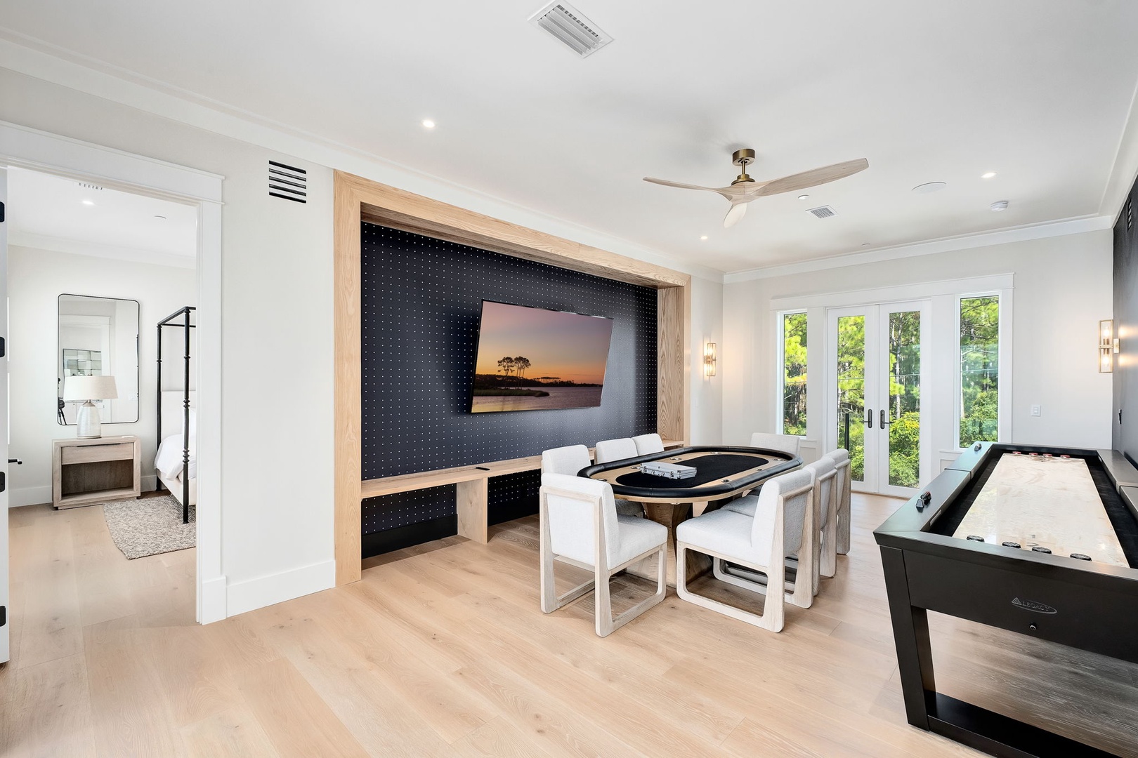Your private game room invites friendly competition around the foosball and air hockey tables, with a sleek media wall and bright garden views to set the scene.