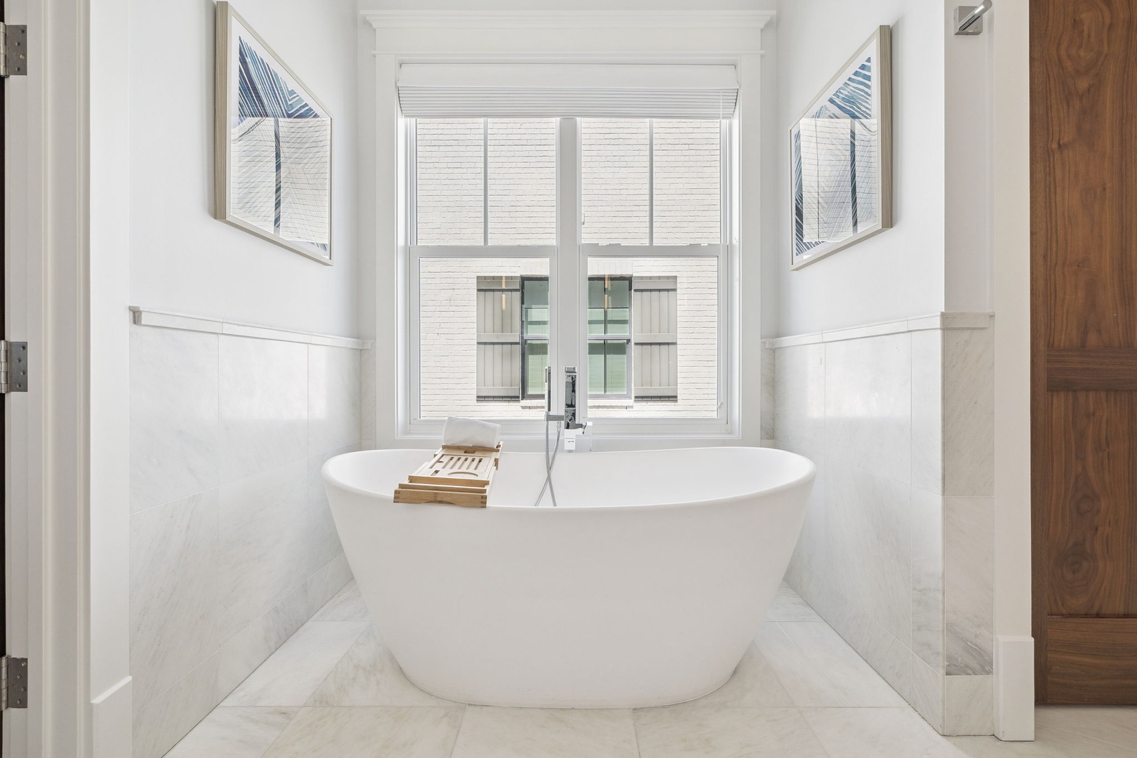 Sink into this elegant freestanding tub and let the stress of travel melt away in your pristine marble sanctuary.