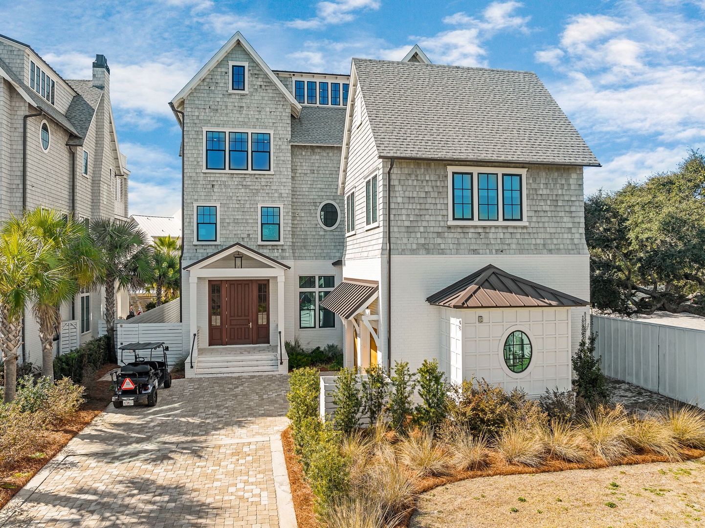Stunning coastal architecture featuring classic shingle-style design with modern touches and beautifully landscaped surroundings.