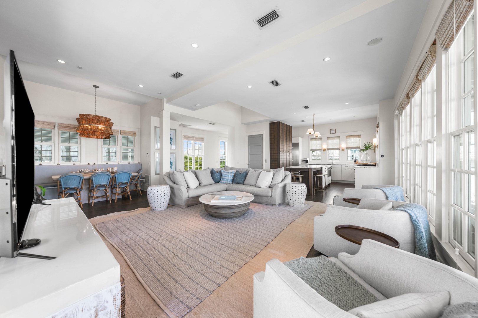 Sink into plush seating where your spacious living room flows seamlessly into a gourmet kitchen, creating the perfect space for relaxation and entertaining.