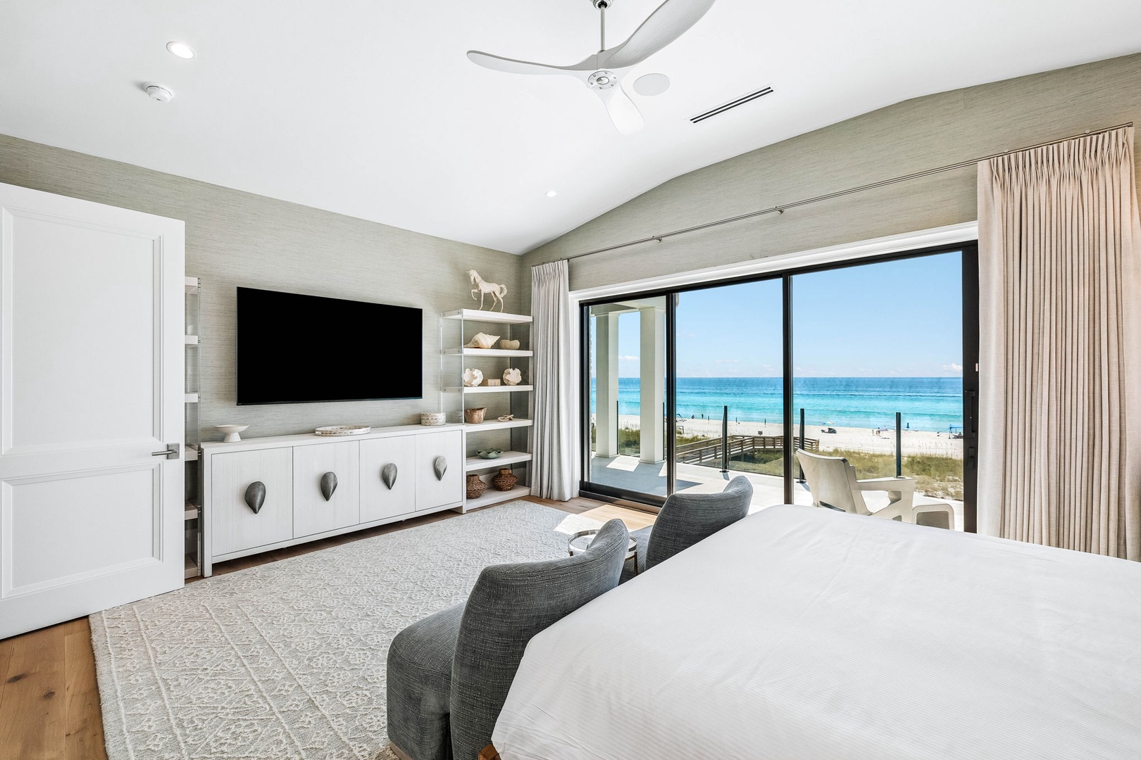 Wake up to breathtaking turquoise waters and soft white sand just beyond your balcony, where ocean breezes fill your serene coastal retreat.