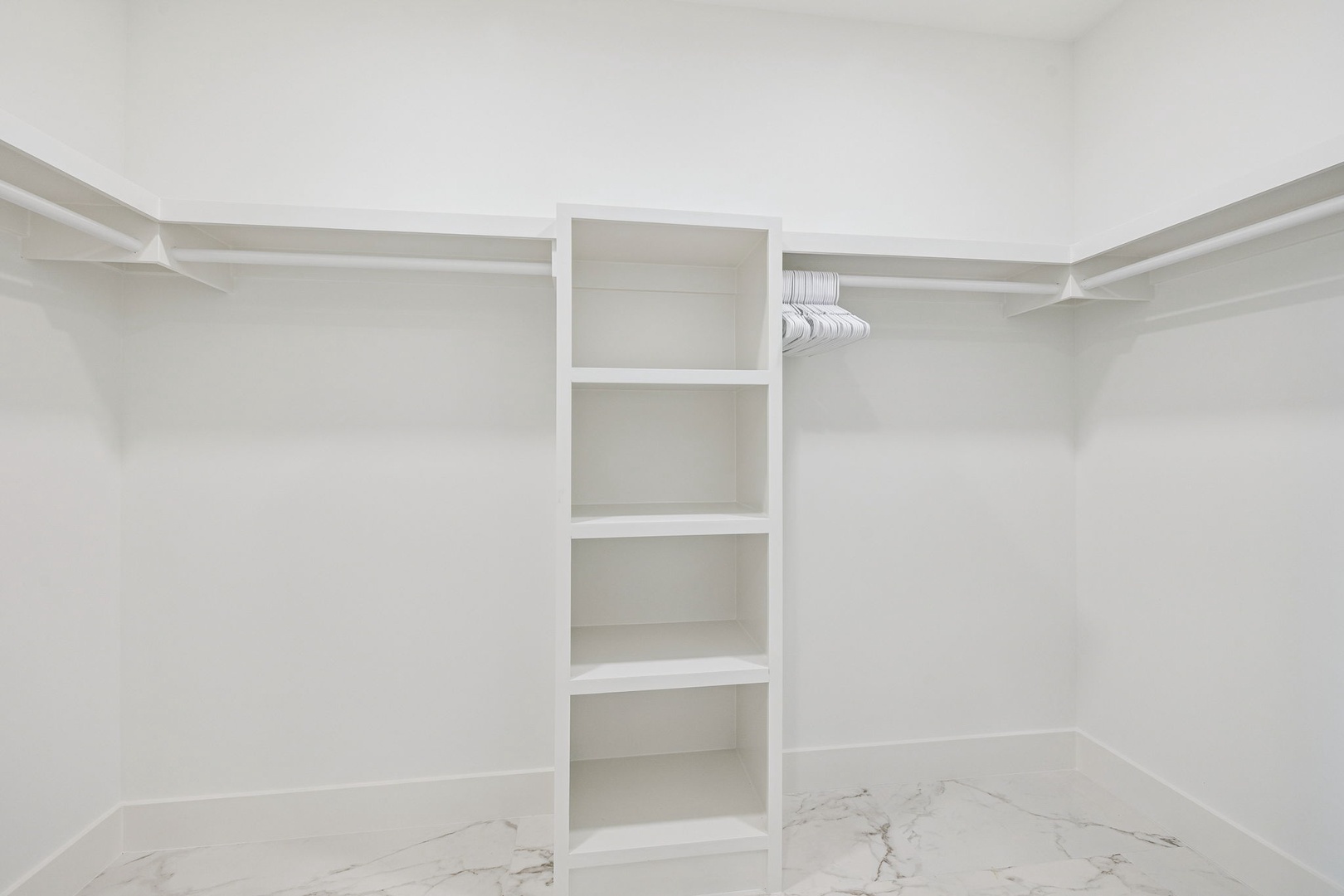 Your spacious walk-in closet offers ample hanging space and built-in shelving to keep your belongings perfectly organized during your stay.