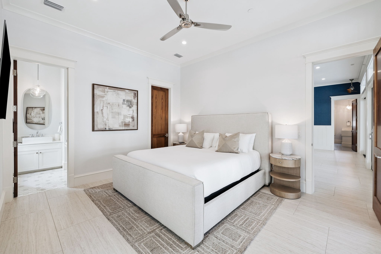 Unwind in your spacious master suite featuring crisp linens, elegant furnishings, and an ensuite bathroom for ultimate comfort.