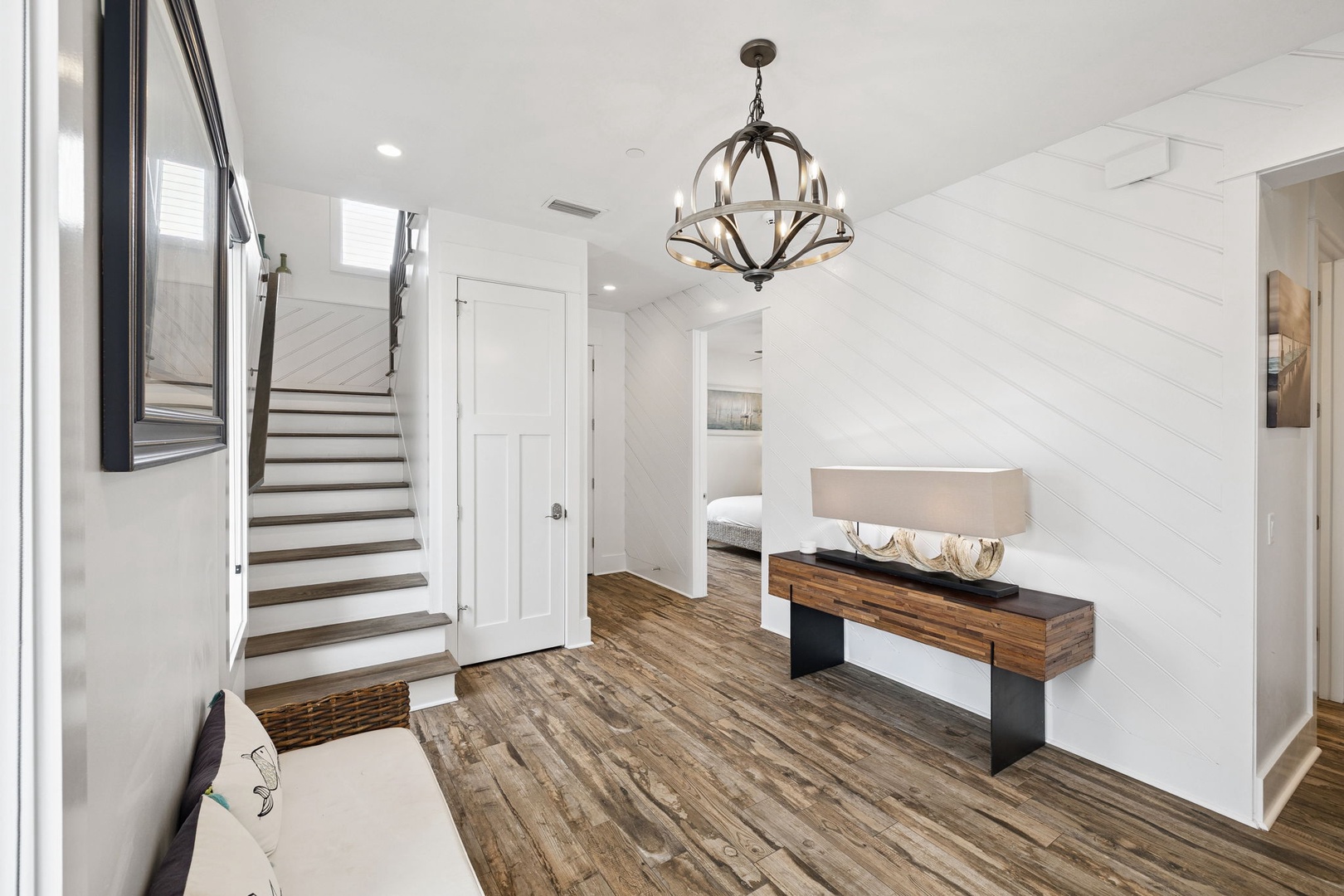 Step into your elegant foyer featuring stunning hardwood floors and a statement chandelier that sets the tone for luxury.