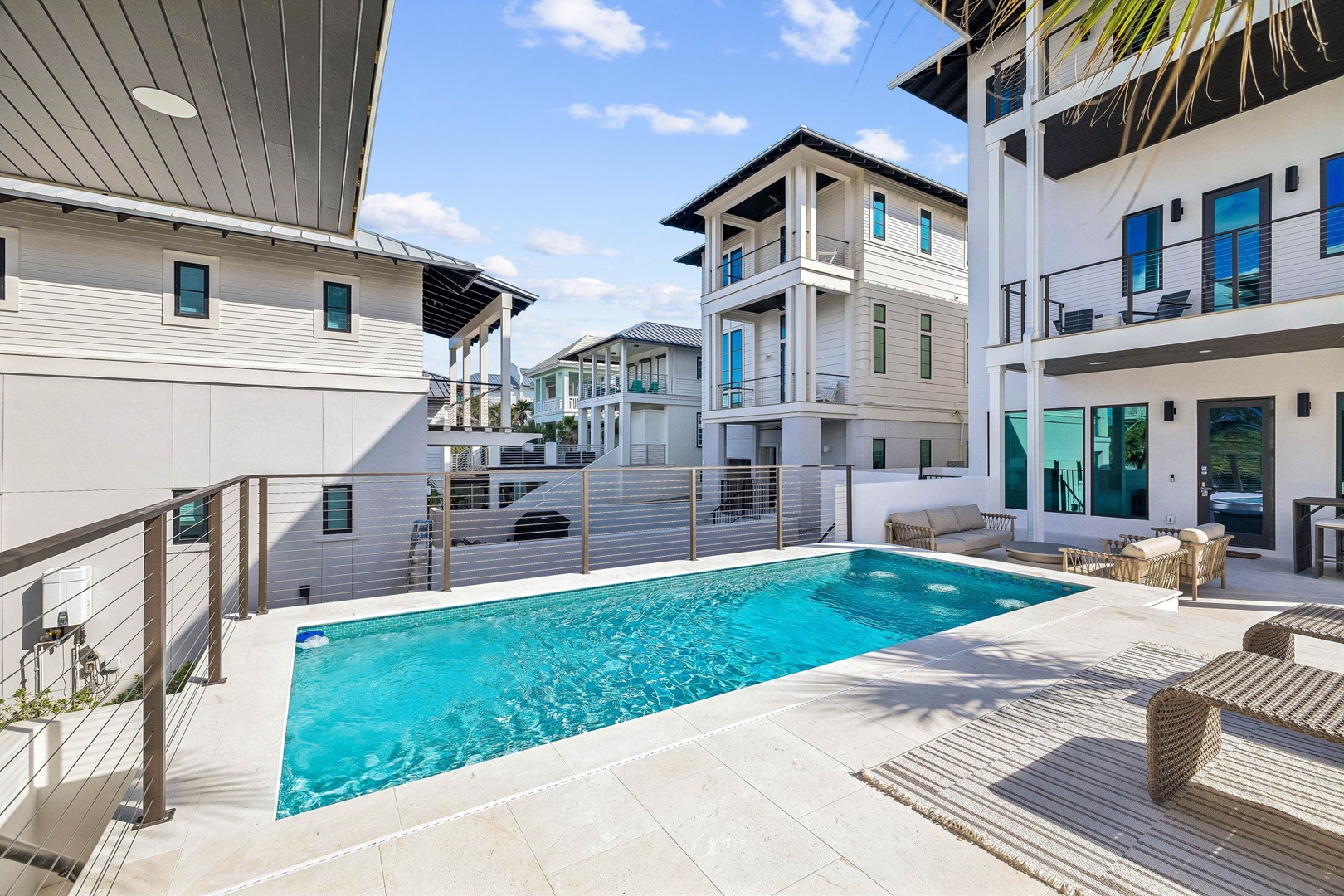 This private pool area sits at the heart of modern coastal living, surrounded by sleek architecture and natural light. Lounge on sunbeds with refreshing drinks, letting your worries melt away in the warm sun.